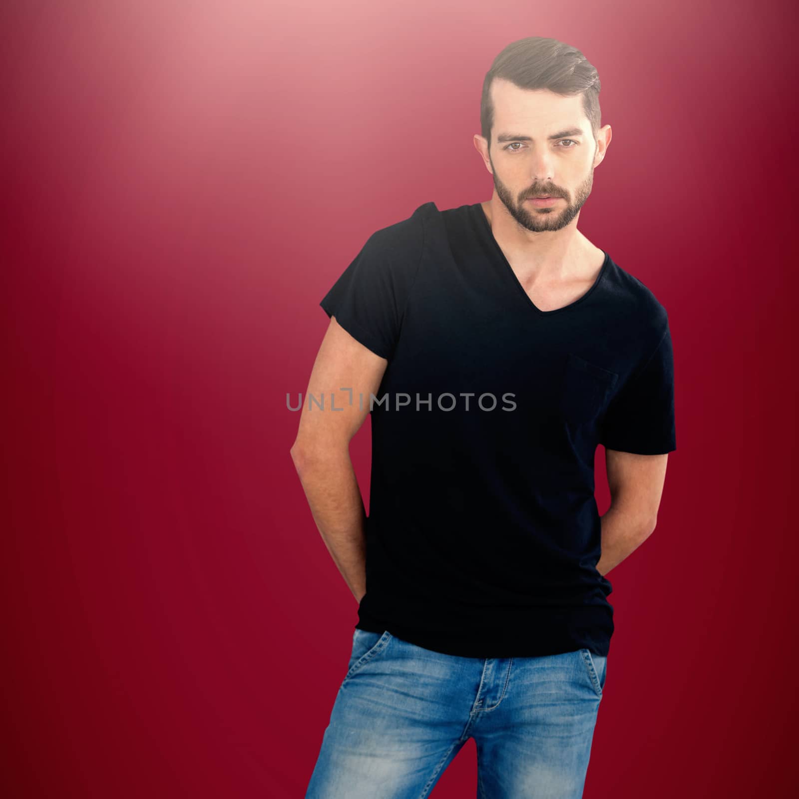 Portrait of young man against white background against pink background 