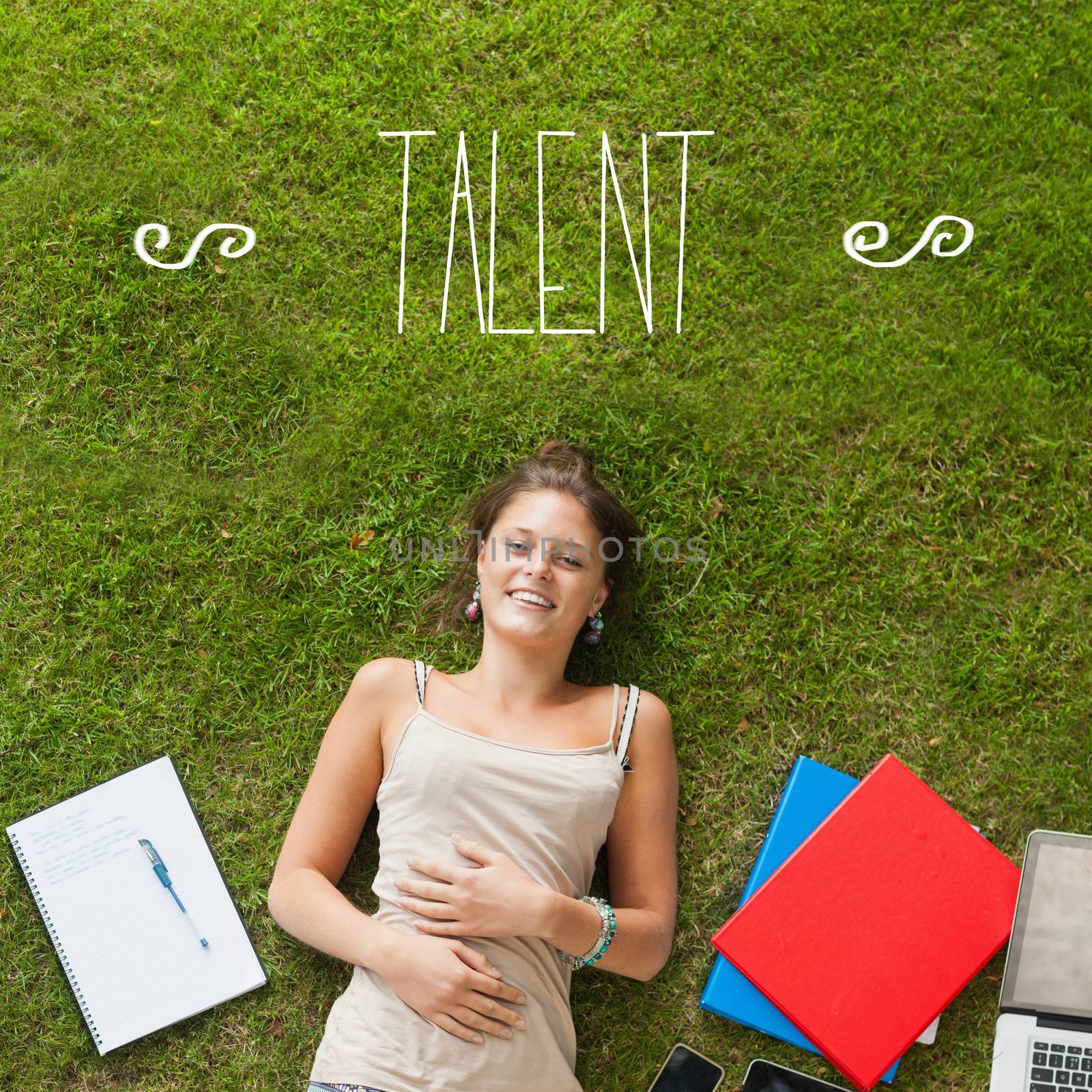 The word talent against pretty student lying on grass
