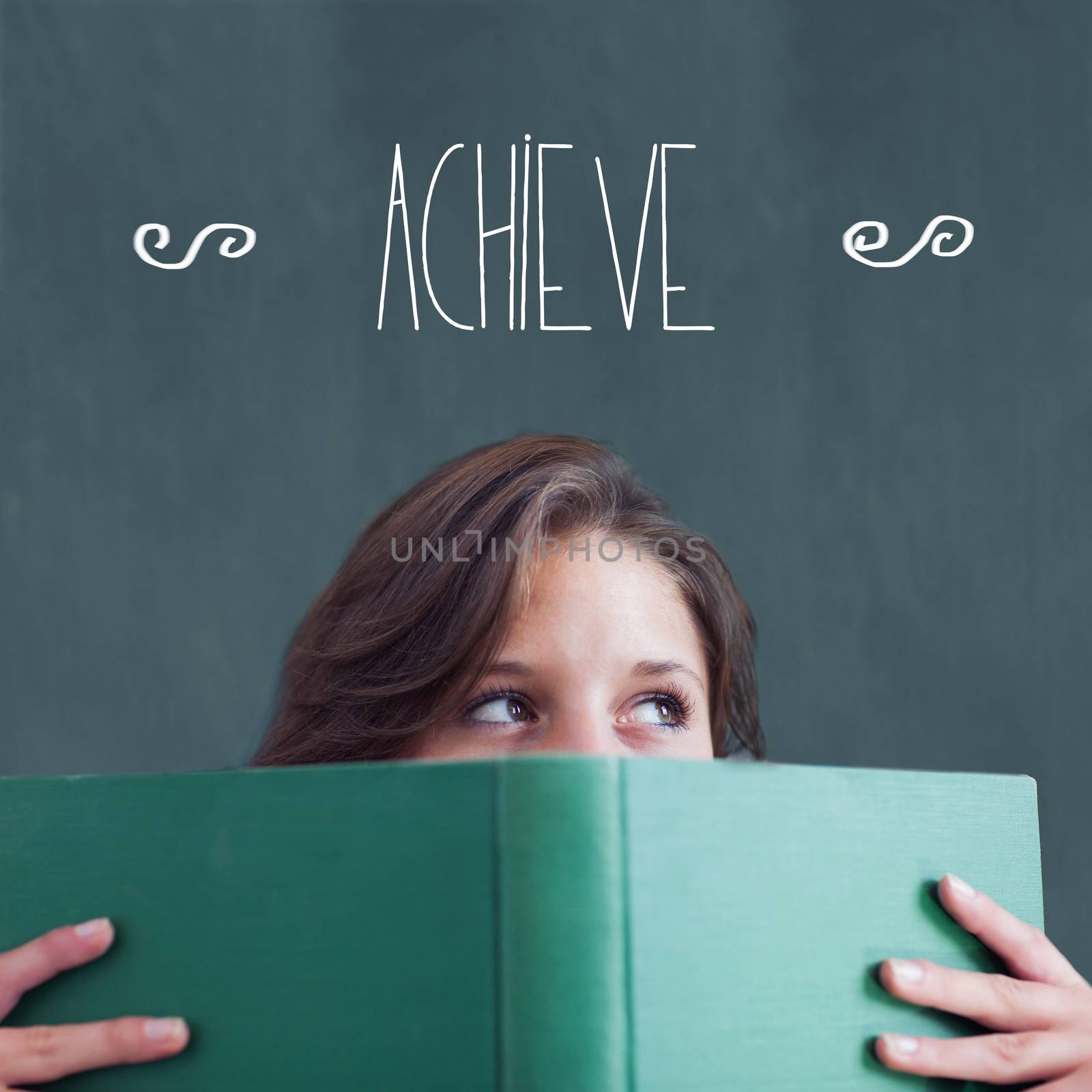 Achieve against student holding book by Wavebreakmedia