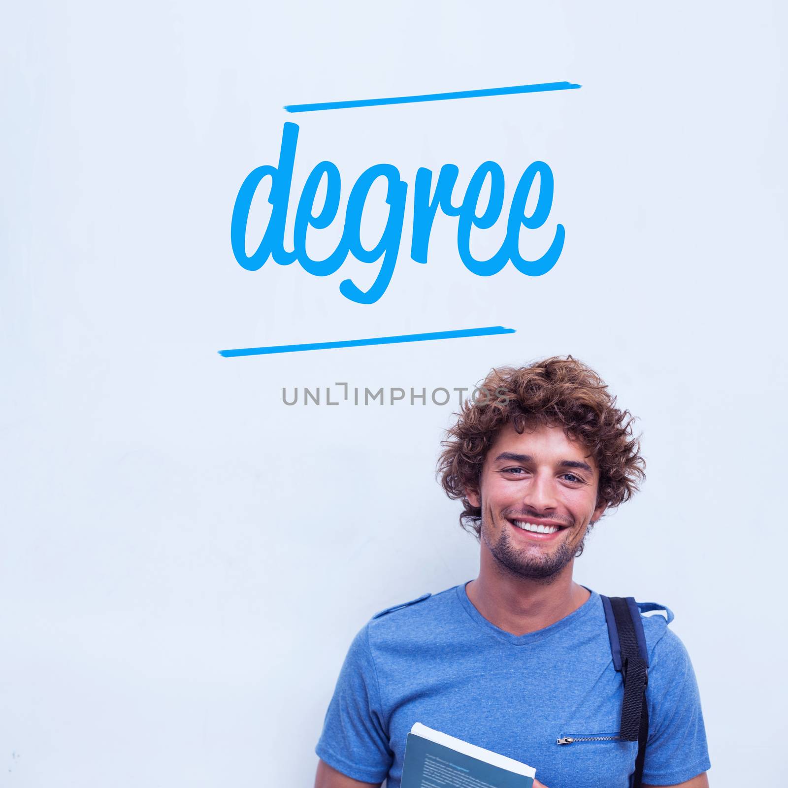 Degree against happy student holding book by Wavebreakmedia