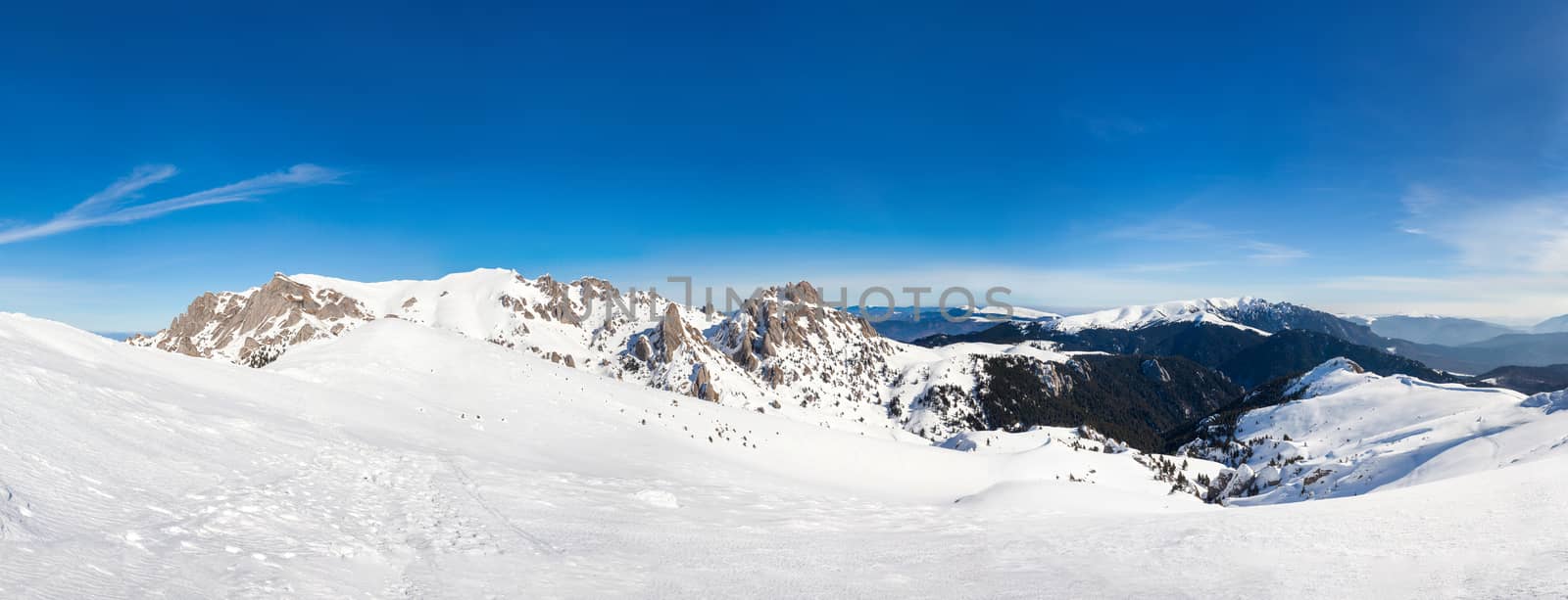 Panoramic view of Mount Ciucas peack on winter, part of romanian Carpathian Range