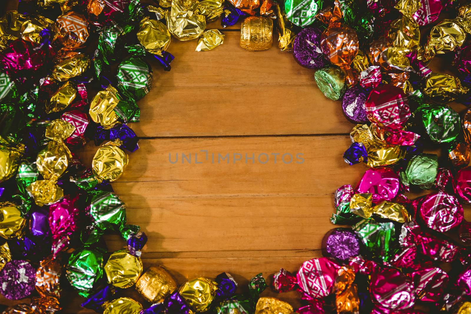 Overhead view of wrapped chocolates arranged on table during Halloween