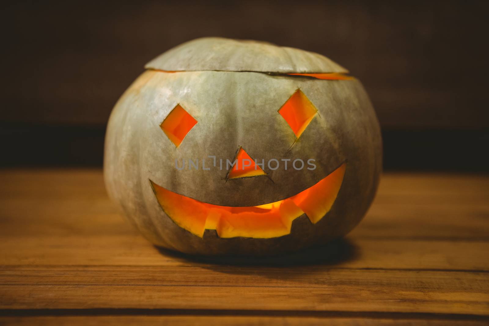 High angle view of illuminated jack o lantern on table during Halloween