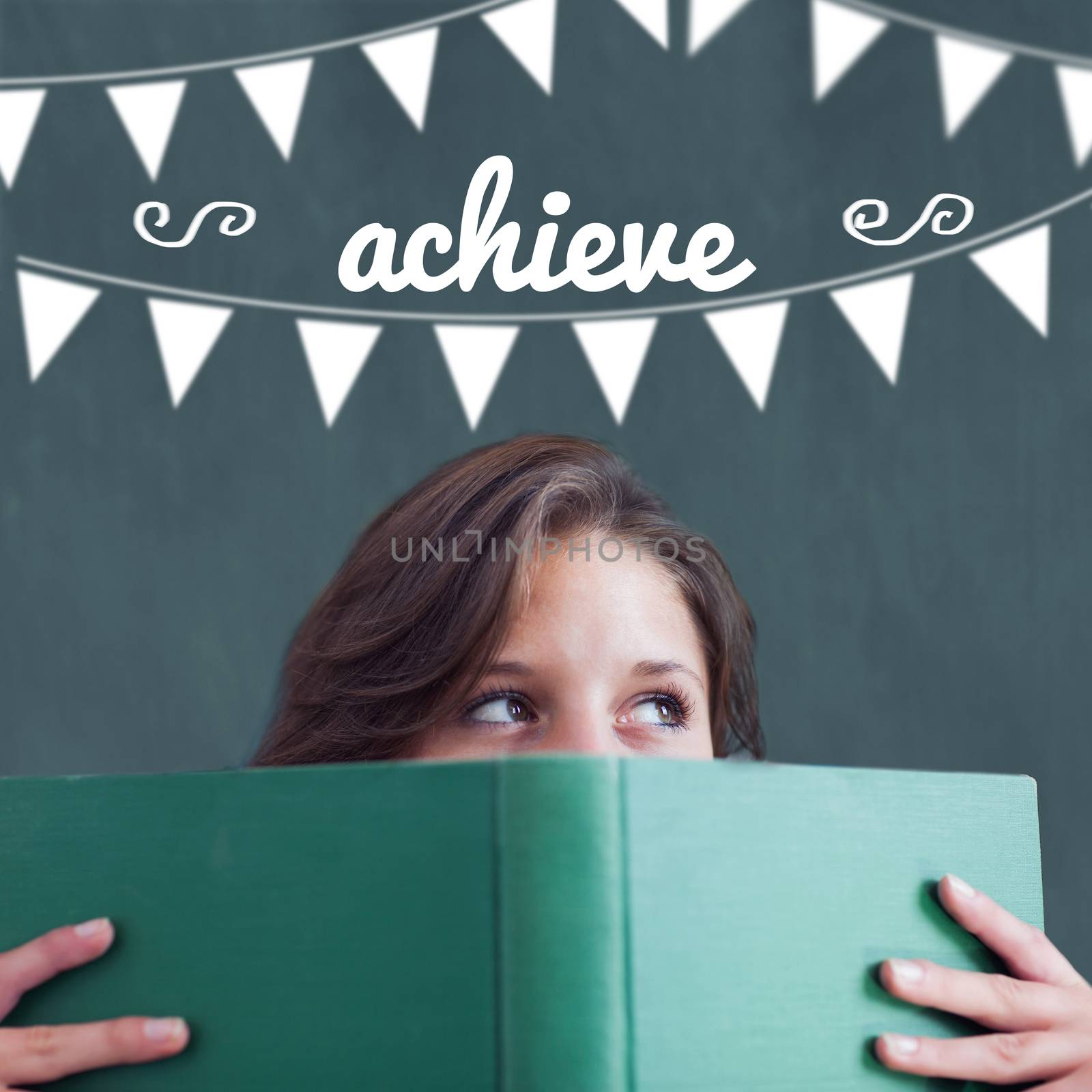 Achieve against student holding book by Wavebreakmedia