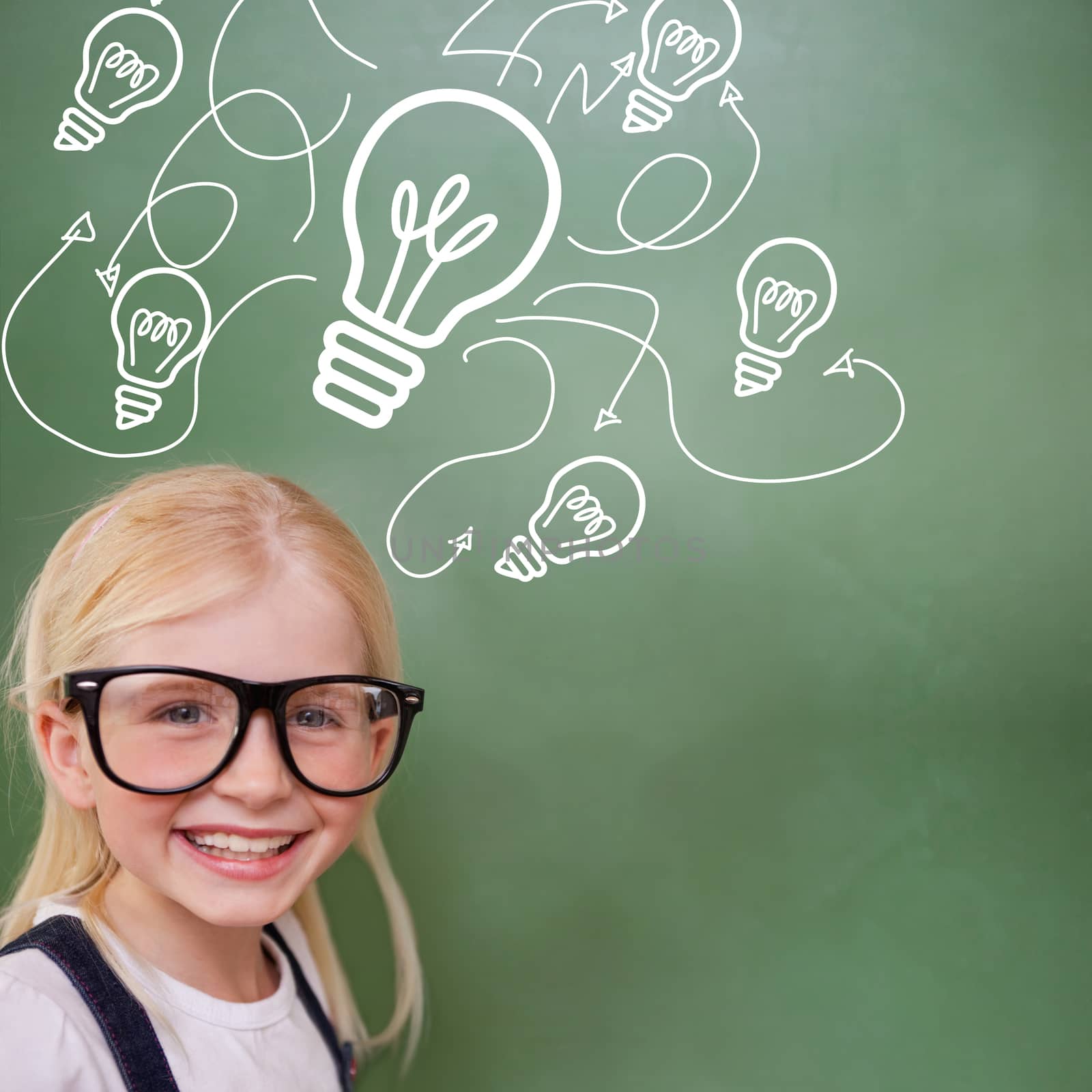 Cute pupil smiling against idea and innovation graphic