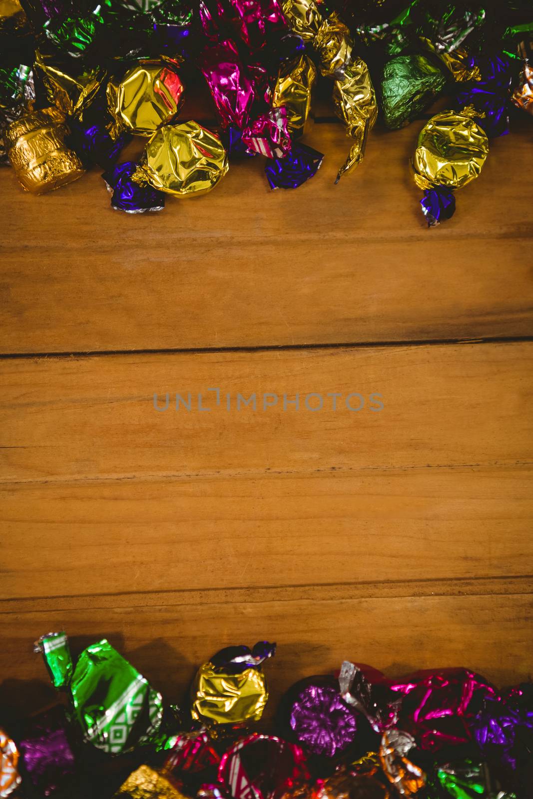 Colorful wrapped chocolates on table during Halloween by Wavebreakmedia