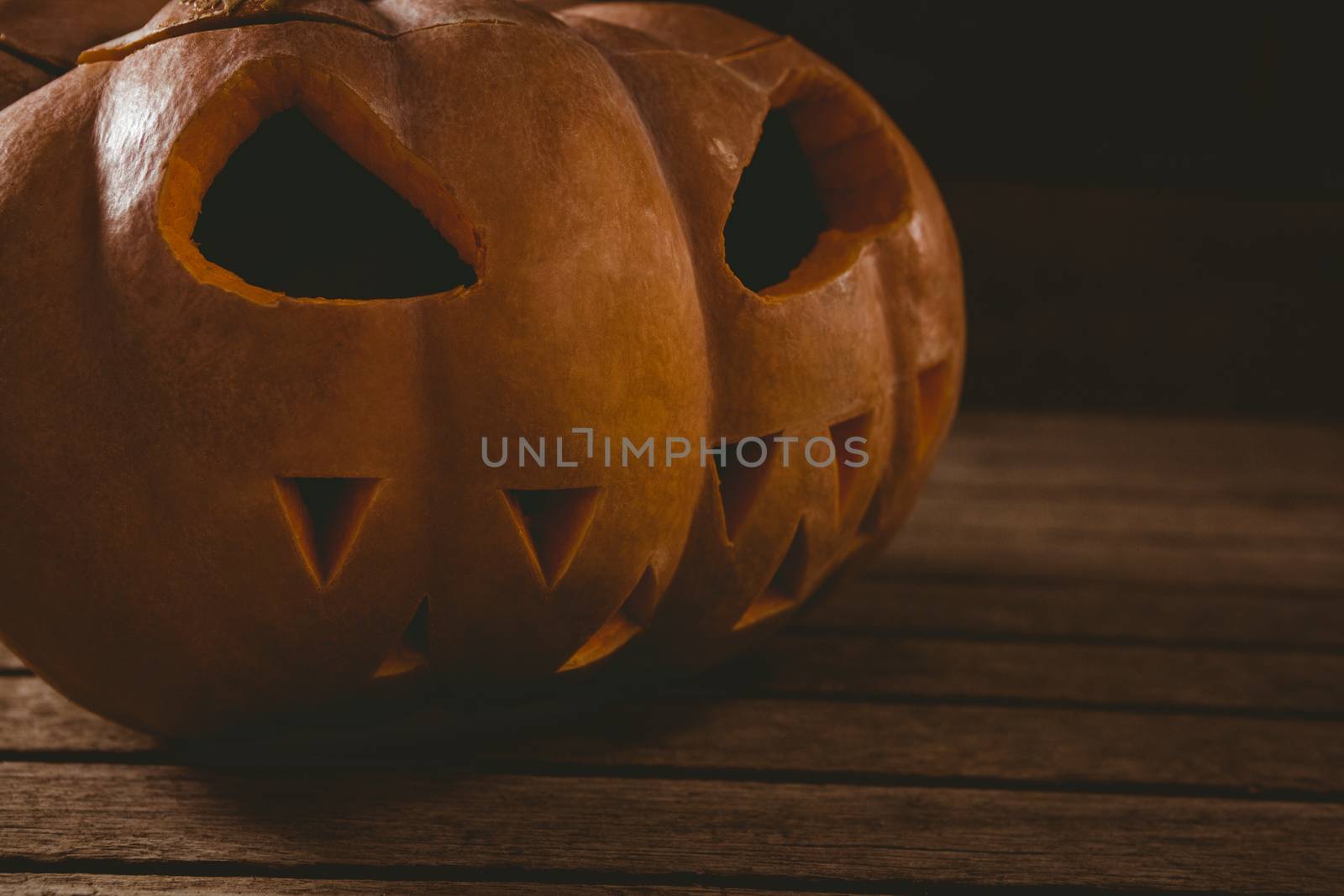 Close up of jack o lantern on table during Halloween