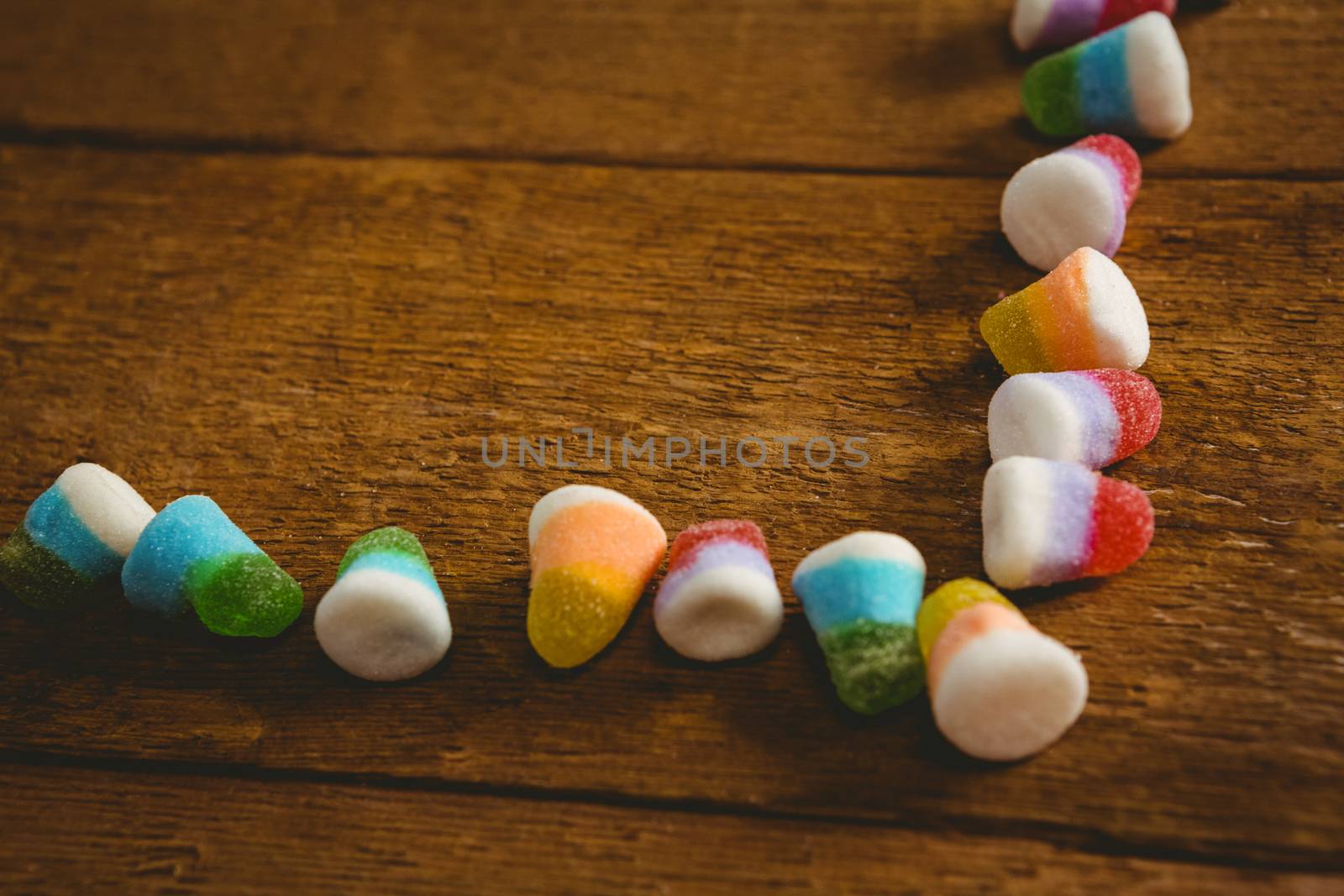 Close up of colorful Halloween candies arranged on table by Wavebreakmedia