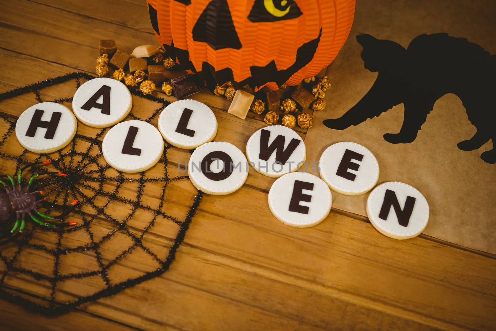 High angle view of cookies with Halloween text and decorations by Wavebreakmedia