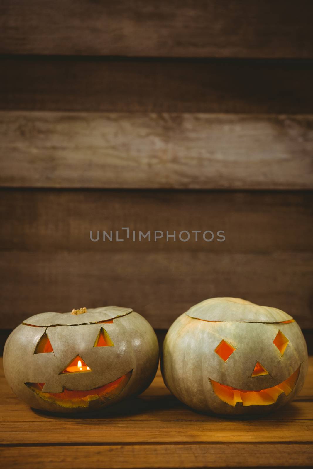 High angle view of jack o lanterns on table during Halloween by Wavebreakmedia