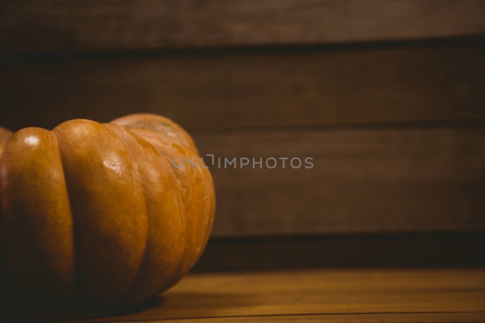 Pumpkin on table during Halloween by Wavebreakmedia