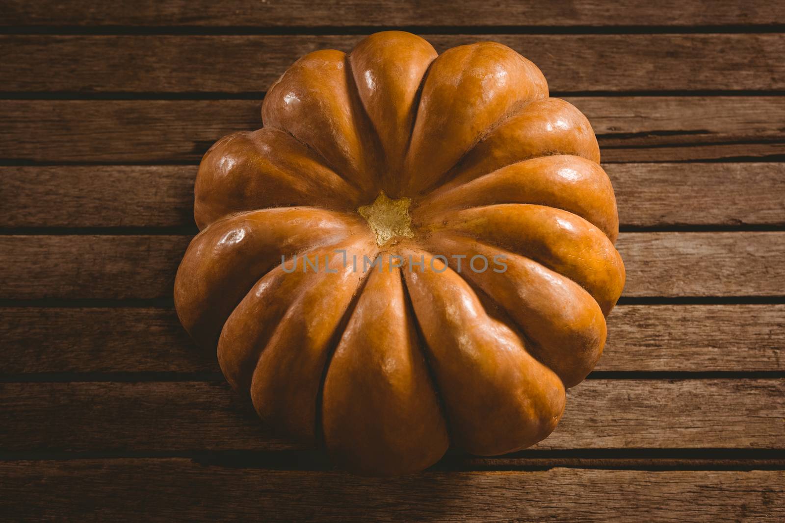 High angle view of pumpkin on wooden table during Halloween