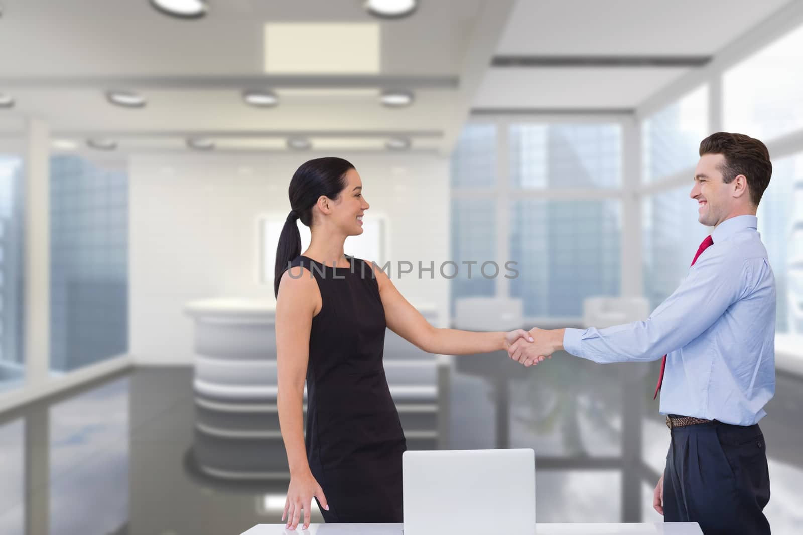 Happy business people shaking hands against office background by Wavebreakmedia