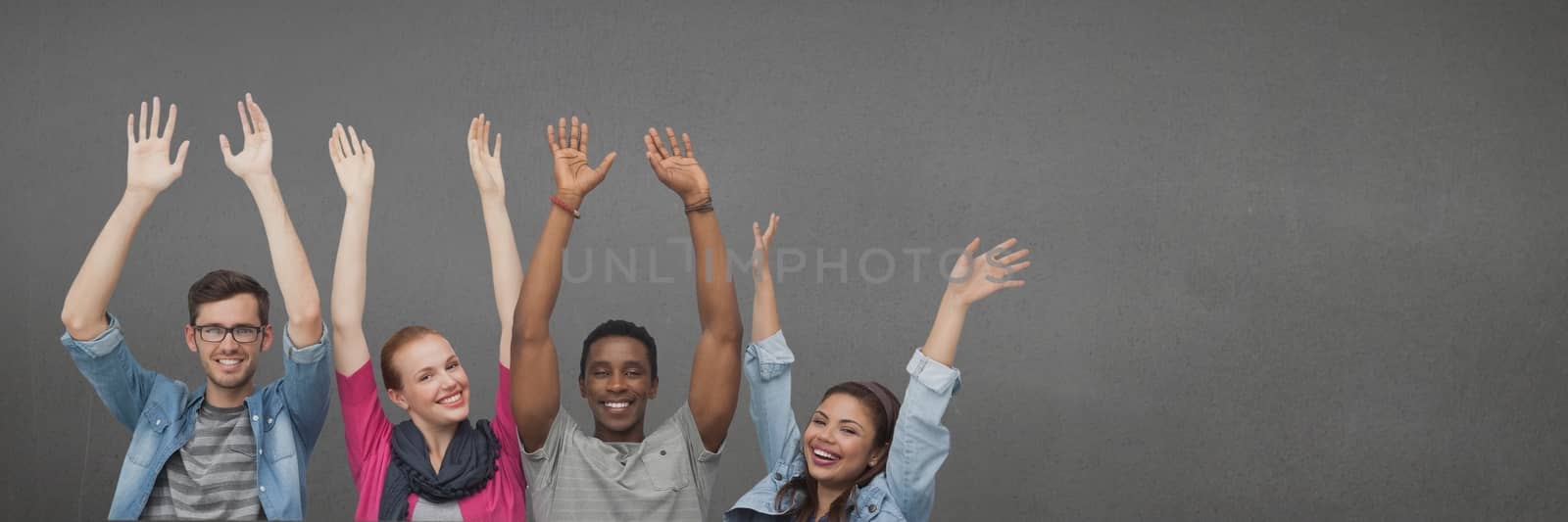 Digital composite of Happy people raising hands against wide blank grey