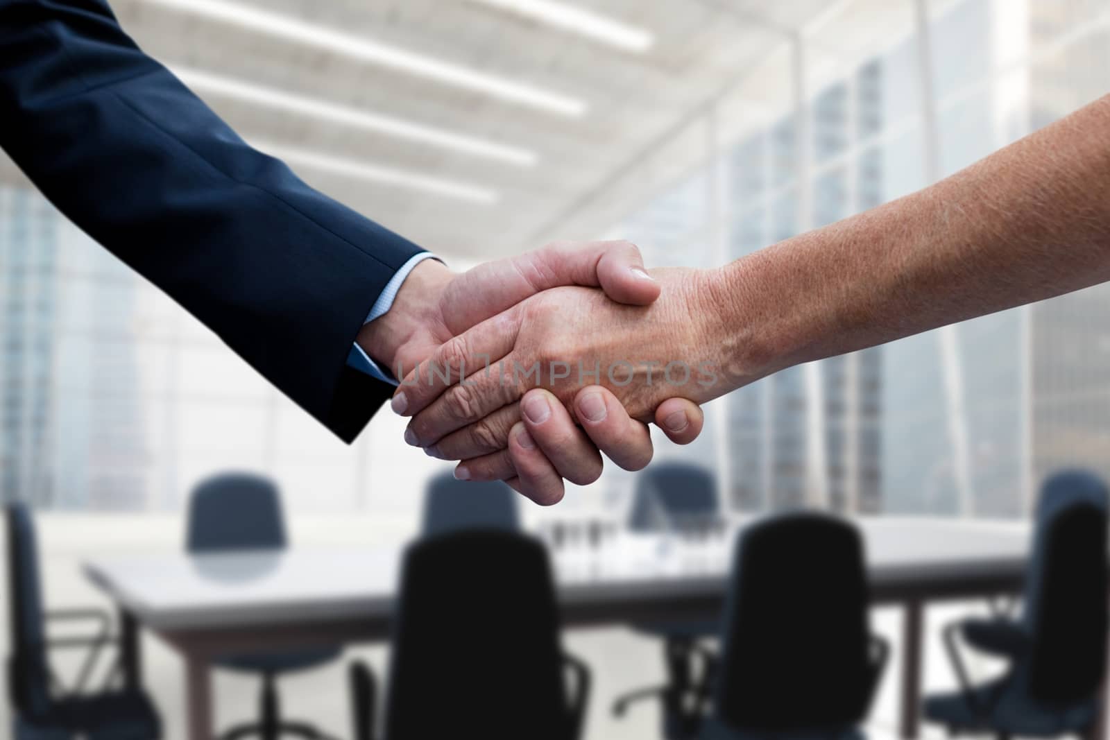 Digital composite of Business people shaking hands against office background