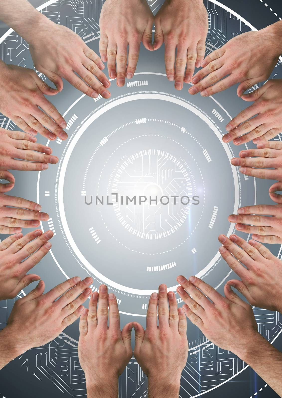 Hands in circle around technology interface by Wavebreakmedia