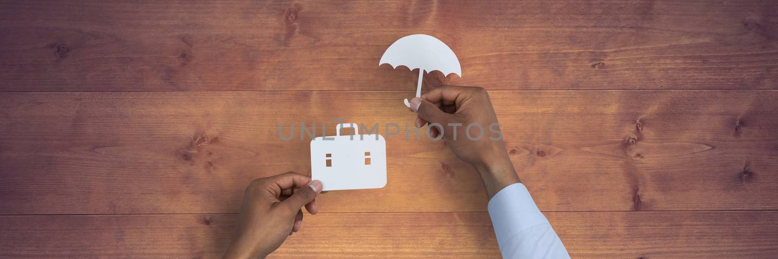 Digital composite of Insurance concept against wood table