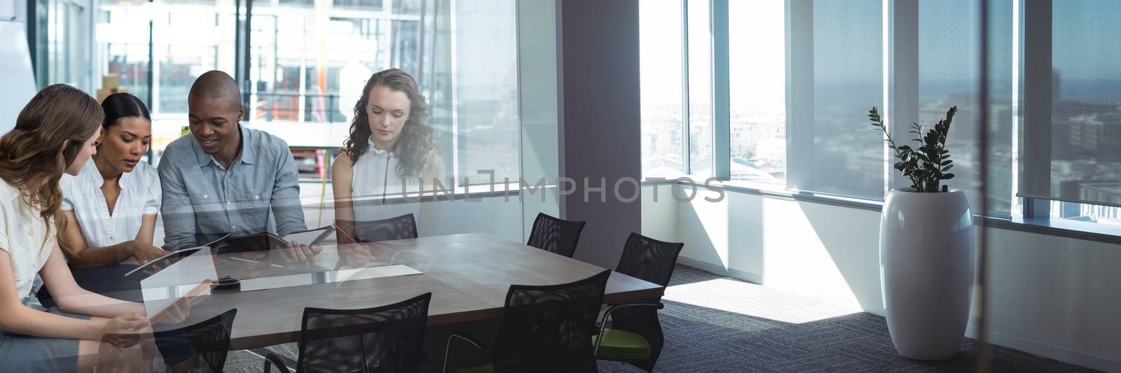 Digital composite of Business people looking at documents