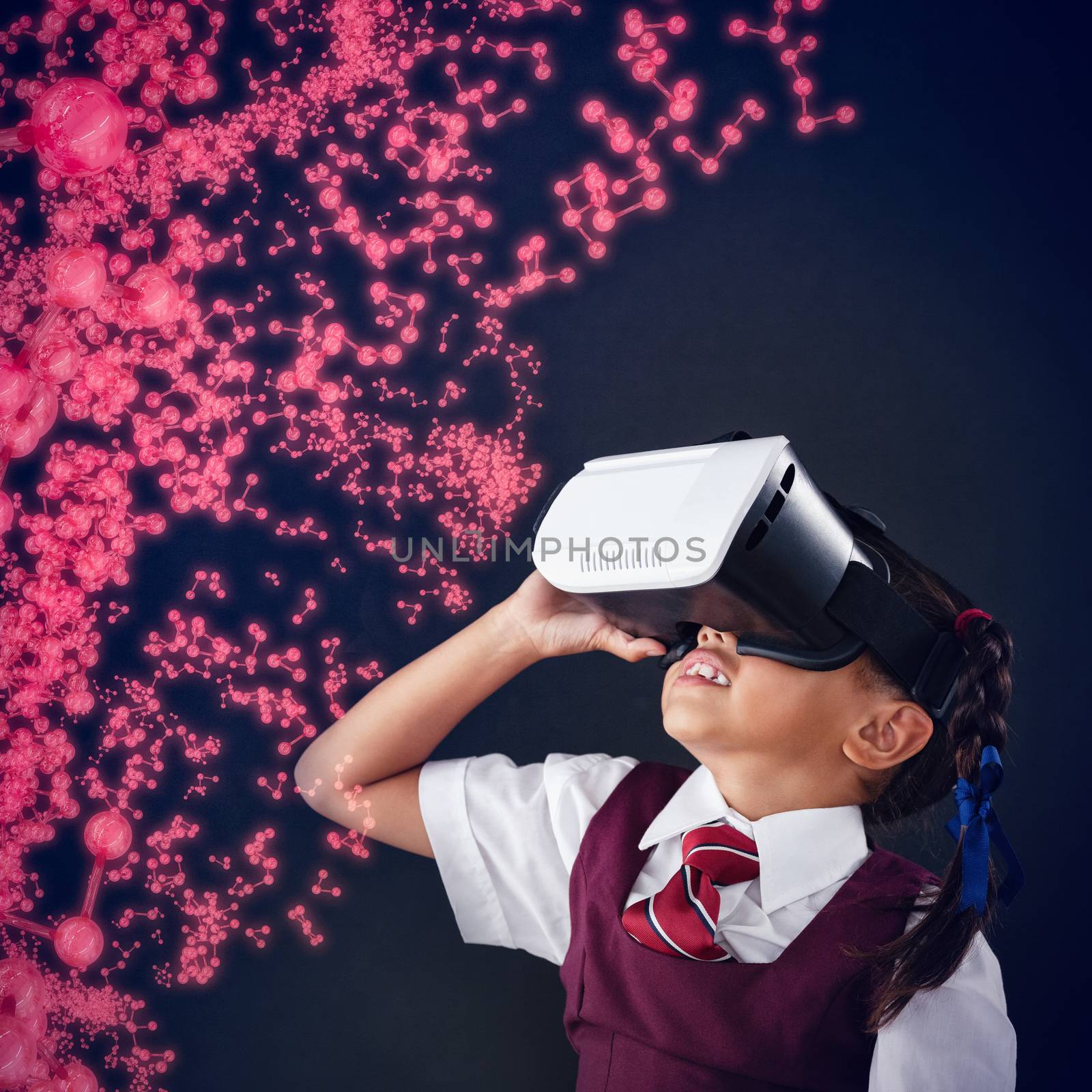 Digitally generated molecular structure against schoolgirl using virtual reality headset against blackboard