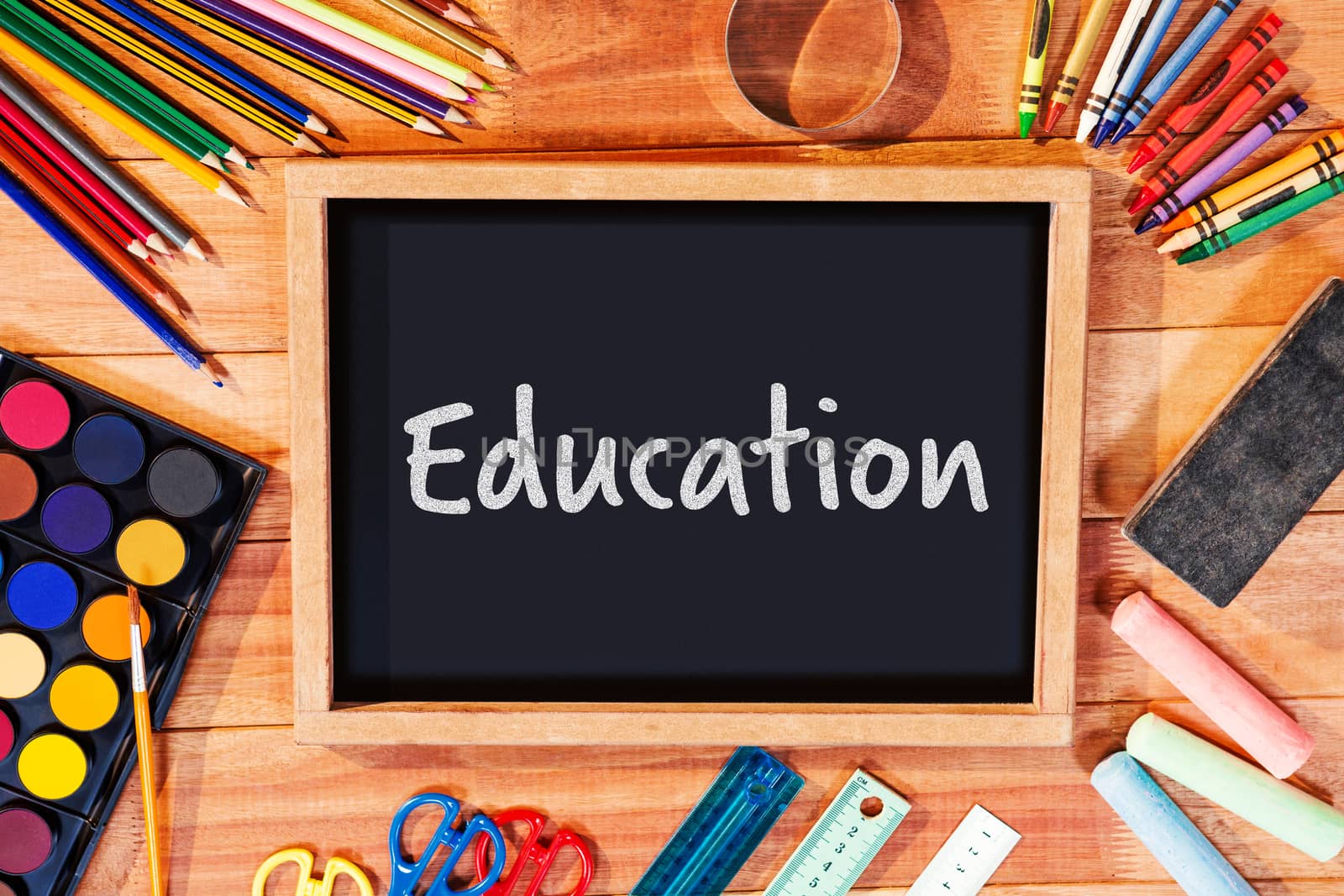 Education text over white background against directly above shot of blackboard with school supplies