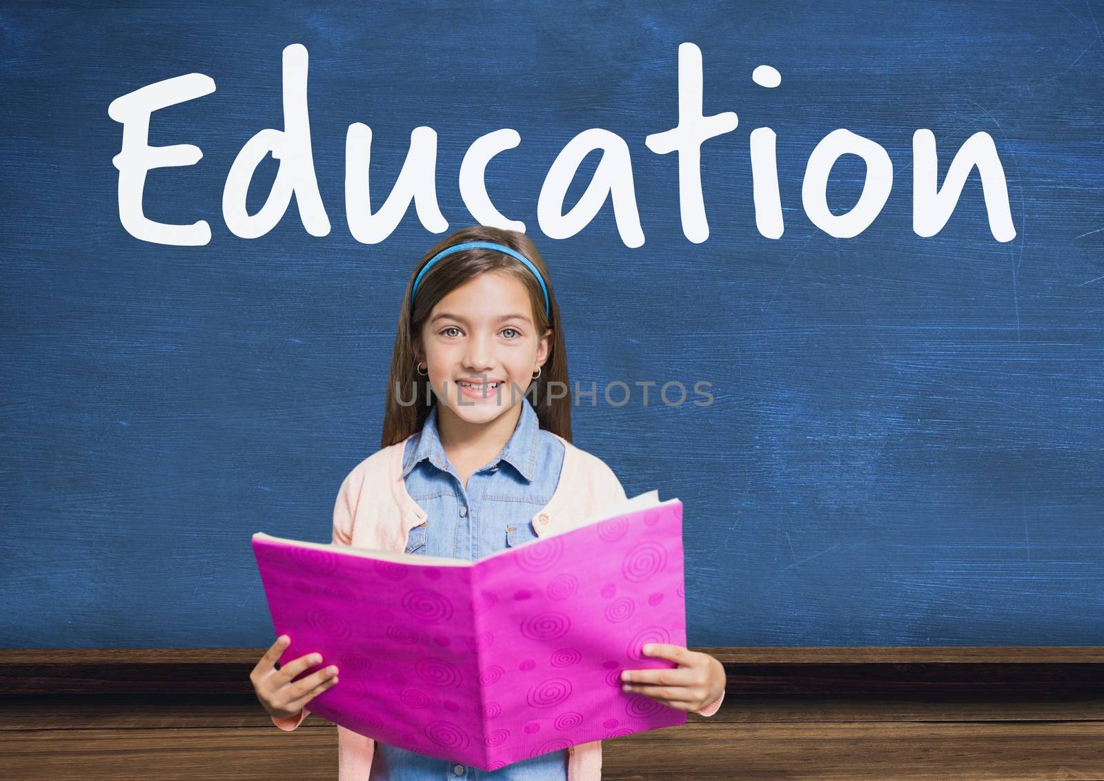 Digital composite of Education text on blackboard with girl reading