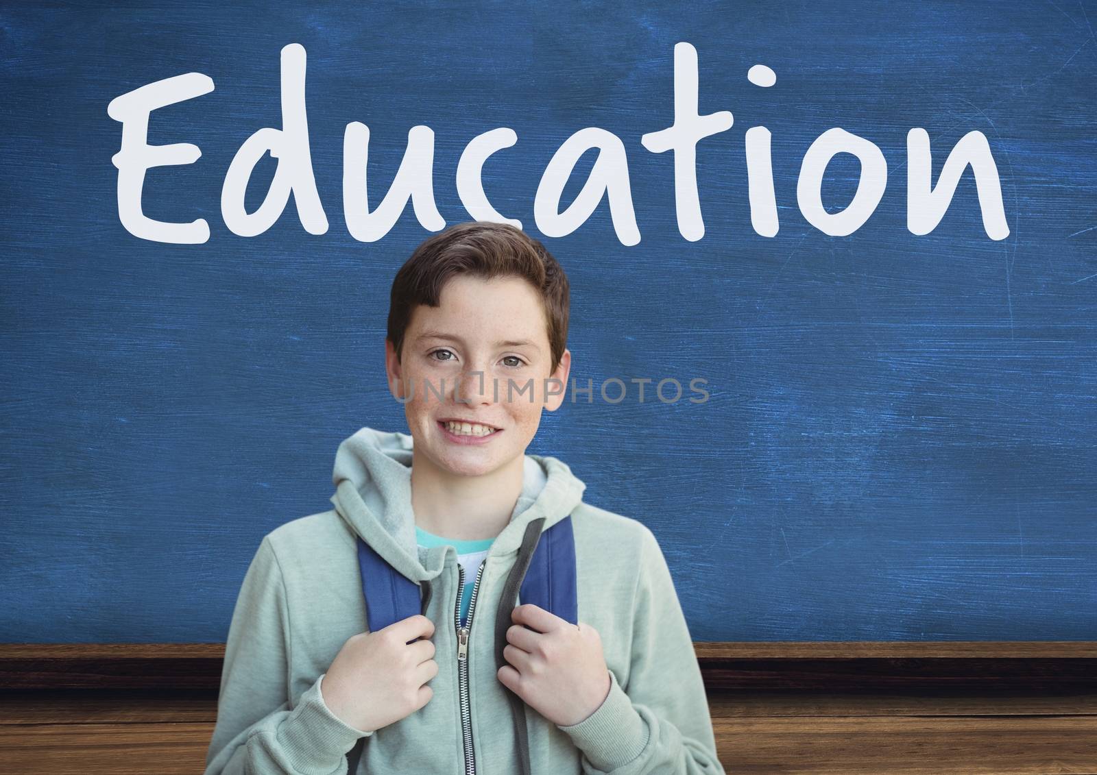 Digital composite of Education text on blackboard with school student