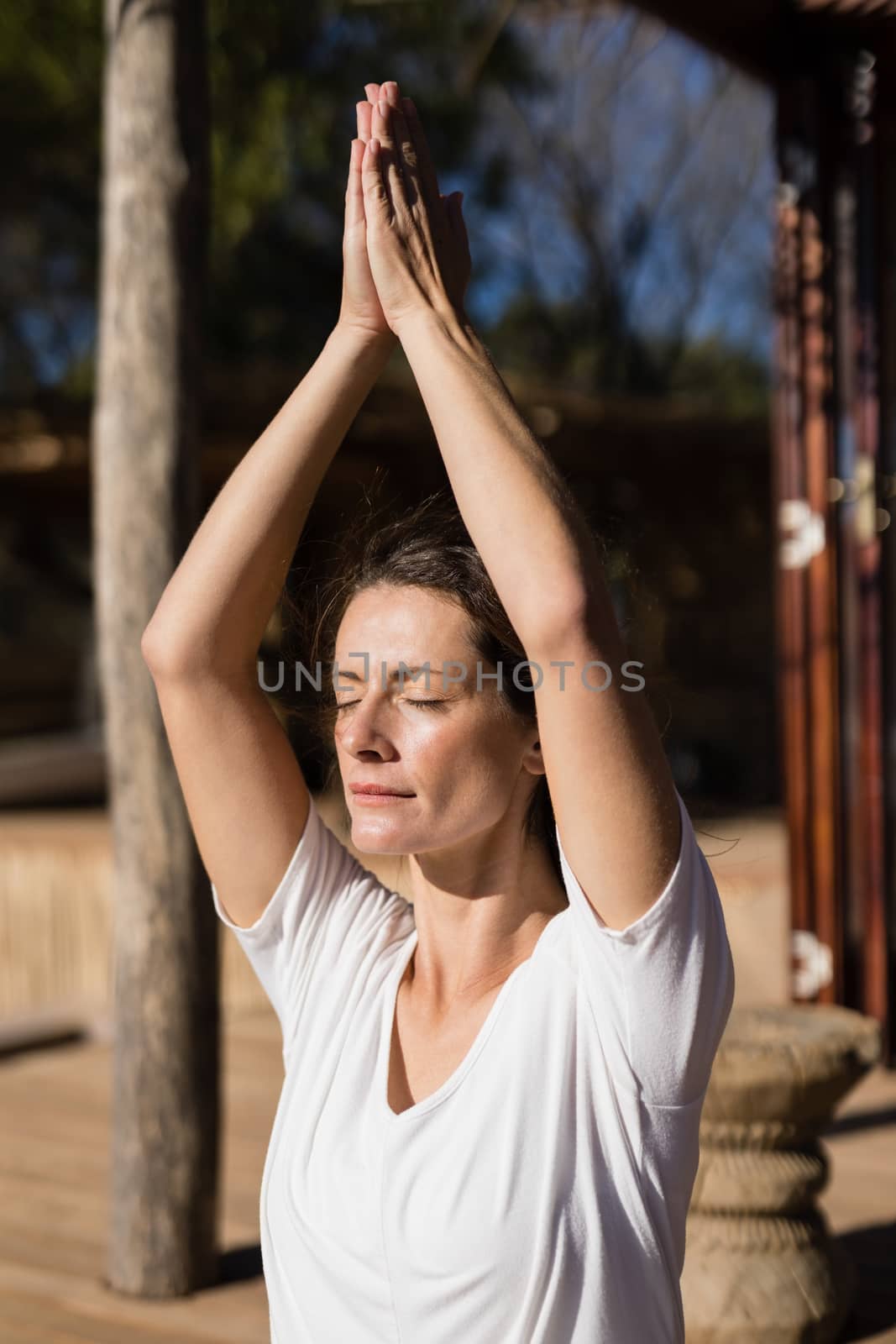 Beautiful woman practicing yoga on a sunny day