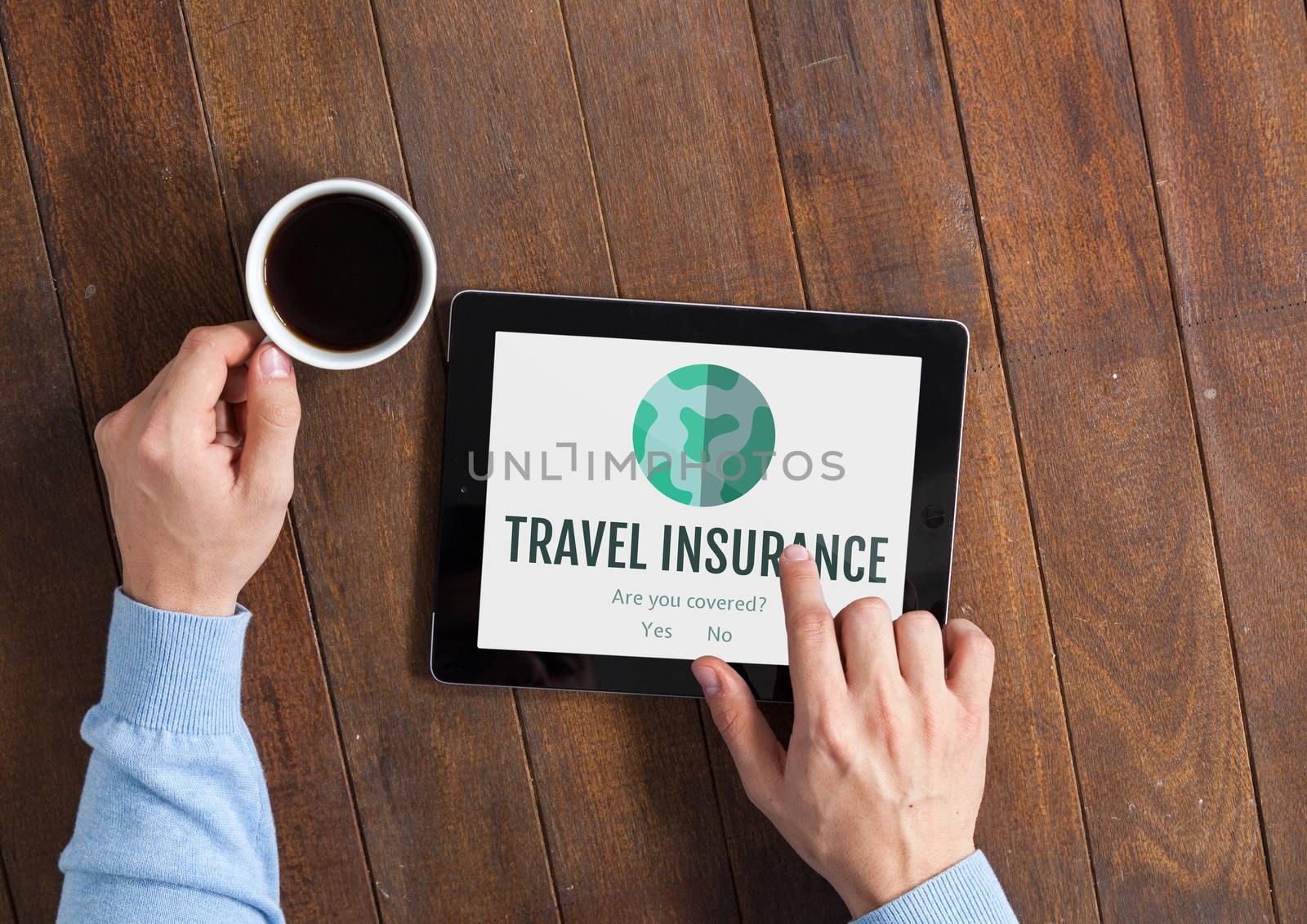 Man using a tablet with travel insurance concept on screen by Wavebreakmedia