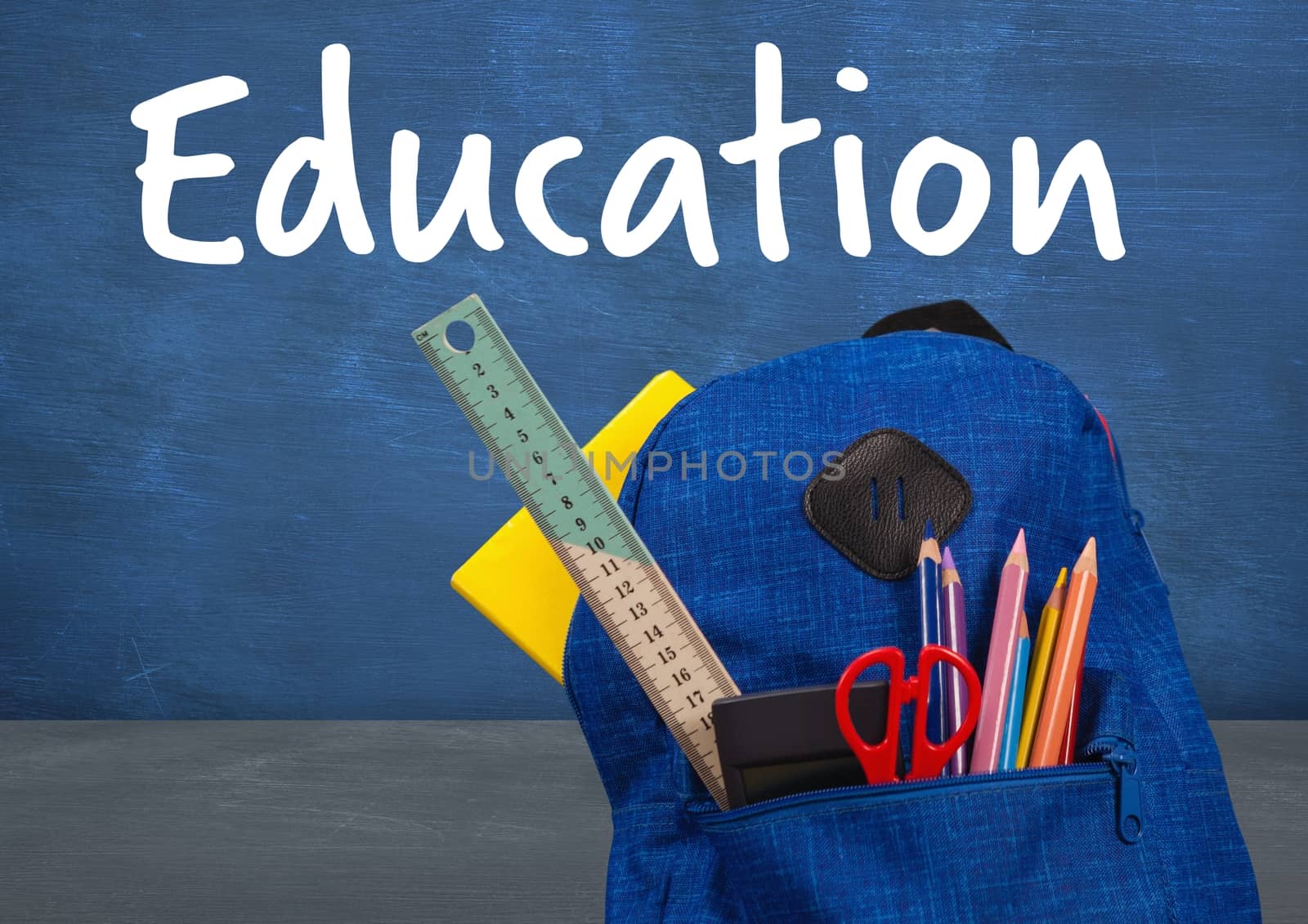 Digital composite of Schoolbag on Desk foreground with blackboard education text