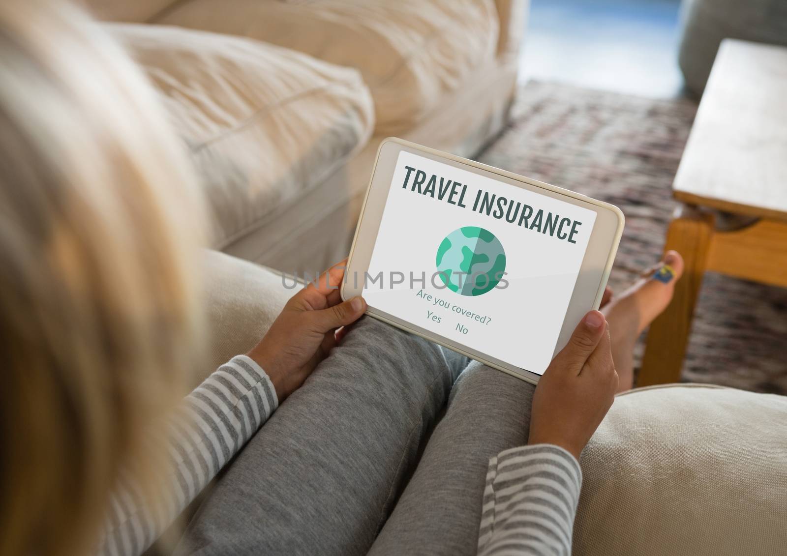 Digital composite of Woman holding a tablet with travel insurance concept on screen