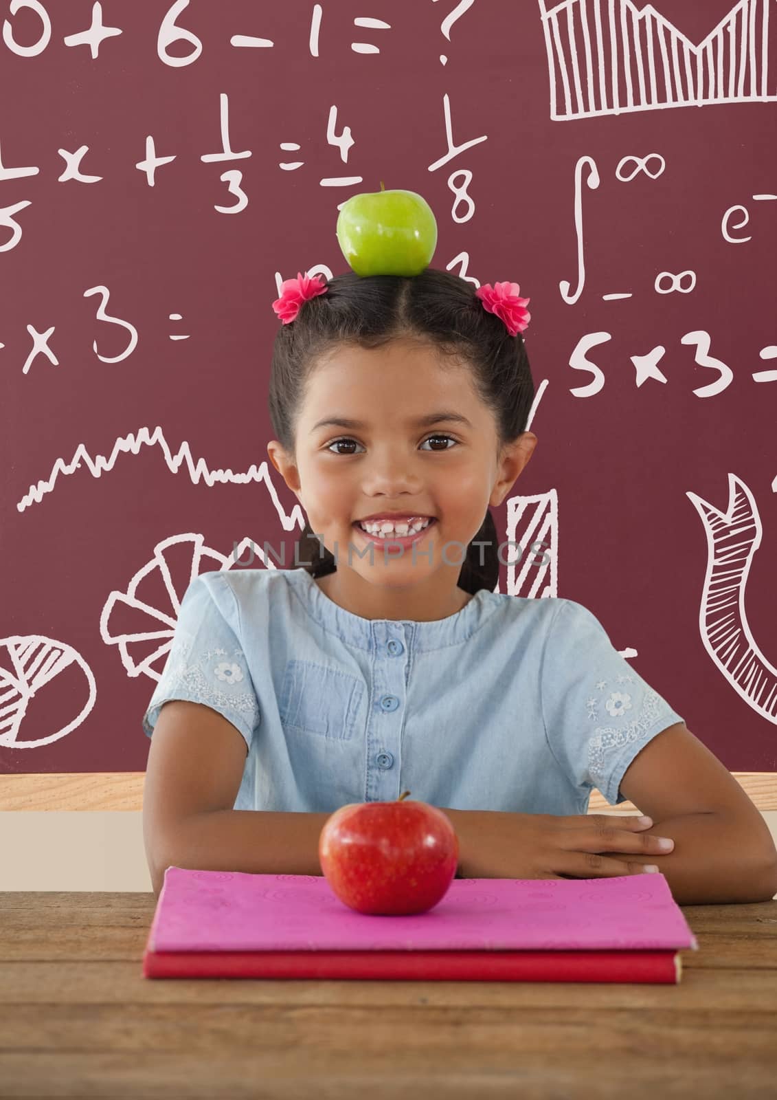 Student girl at table against red blackboard with education and school graphics by Wavebreakmedia