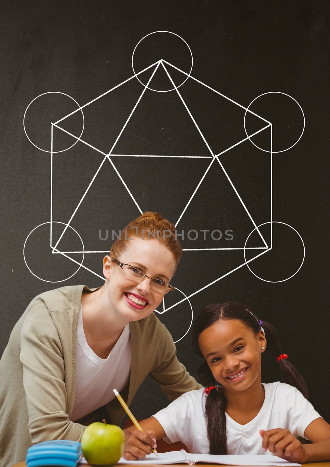 Digital composite of Happy student girl and teacher at table against grey blackboard with school and education graphic