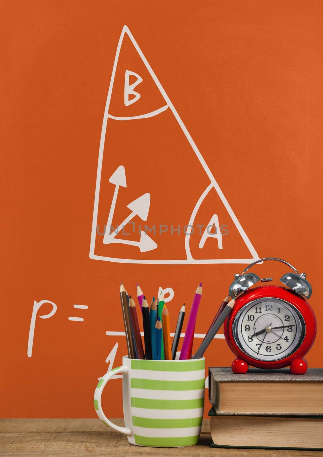 Books on the table against orange blackboard with education and school graphics by Wavebreakmedia