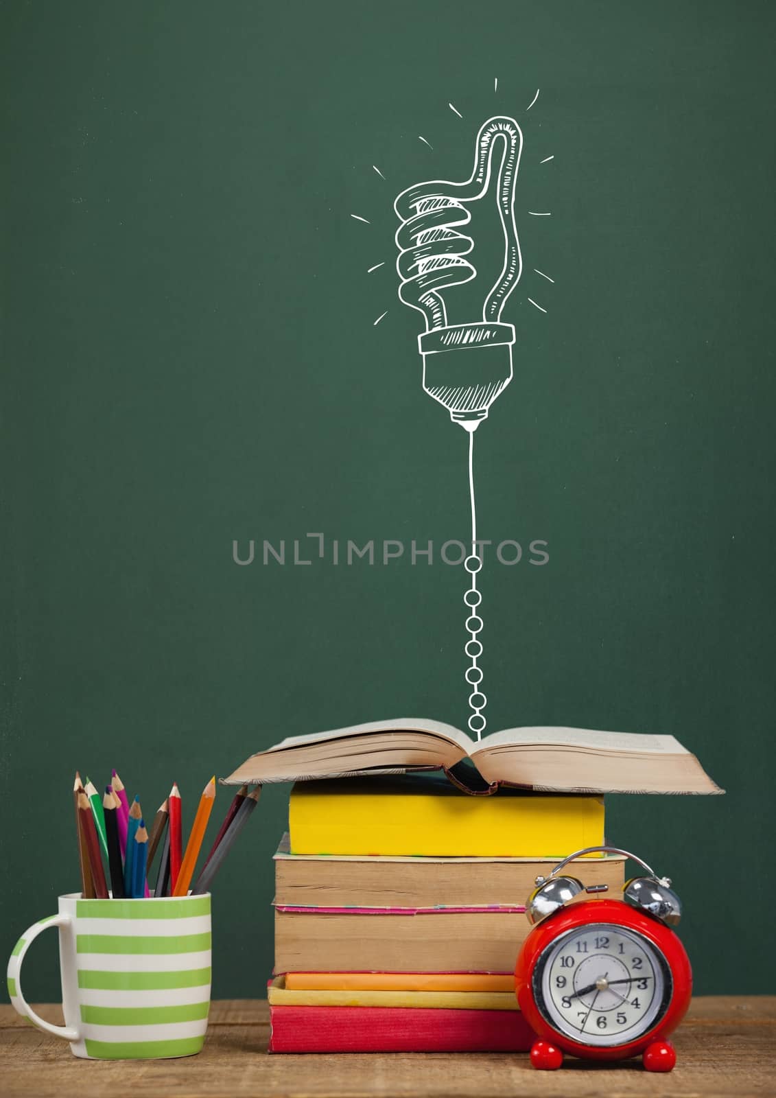Digital composite of Books on the table against green blackboard with education and school graphics