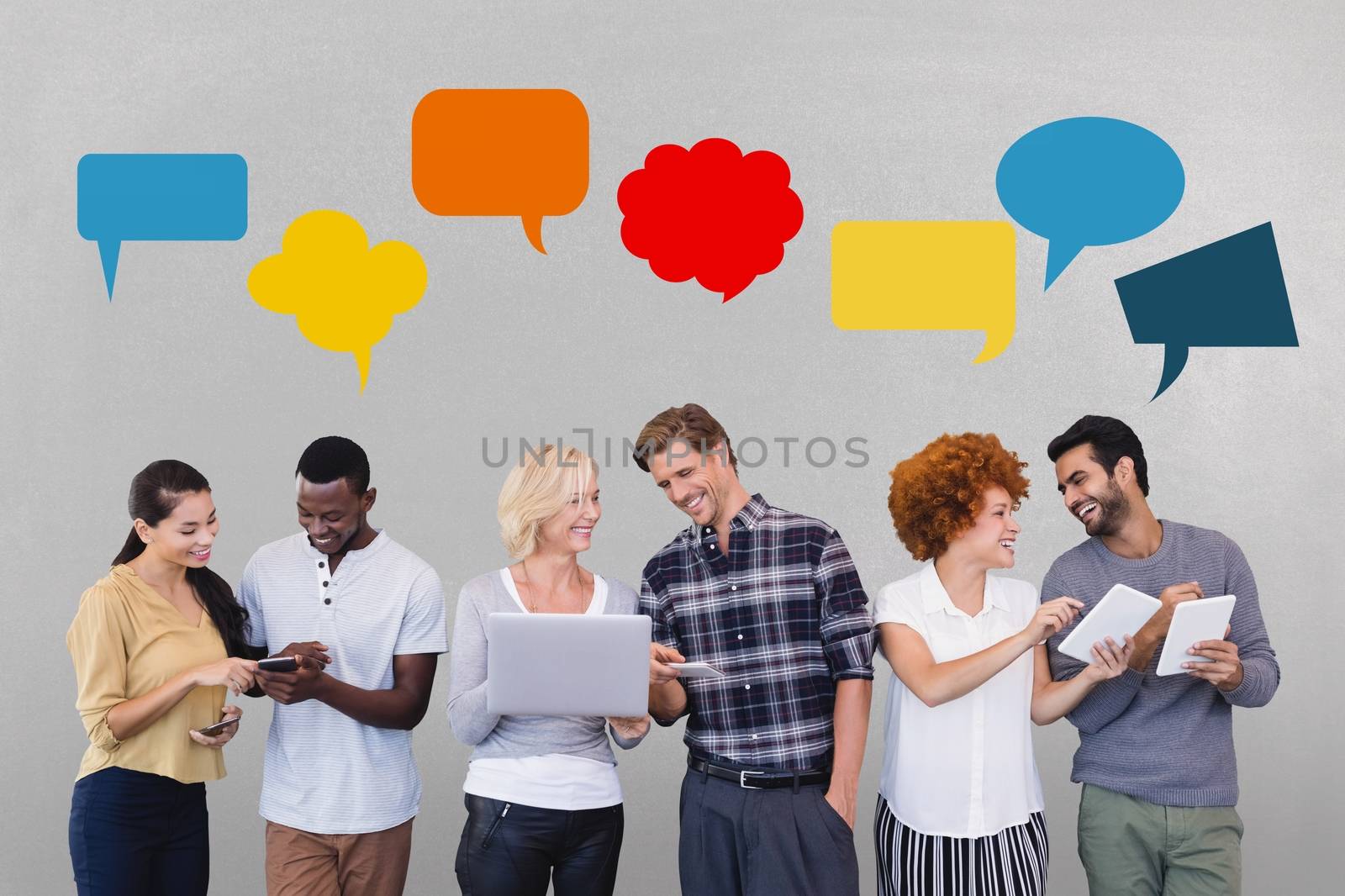 Business people with speech bubble talking against grey background by Wavebreakmedia