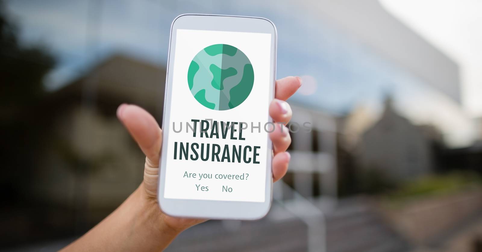 Person holding a phone with travel insurance concept on screen by Wavebreakmedia
