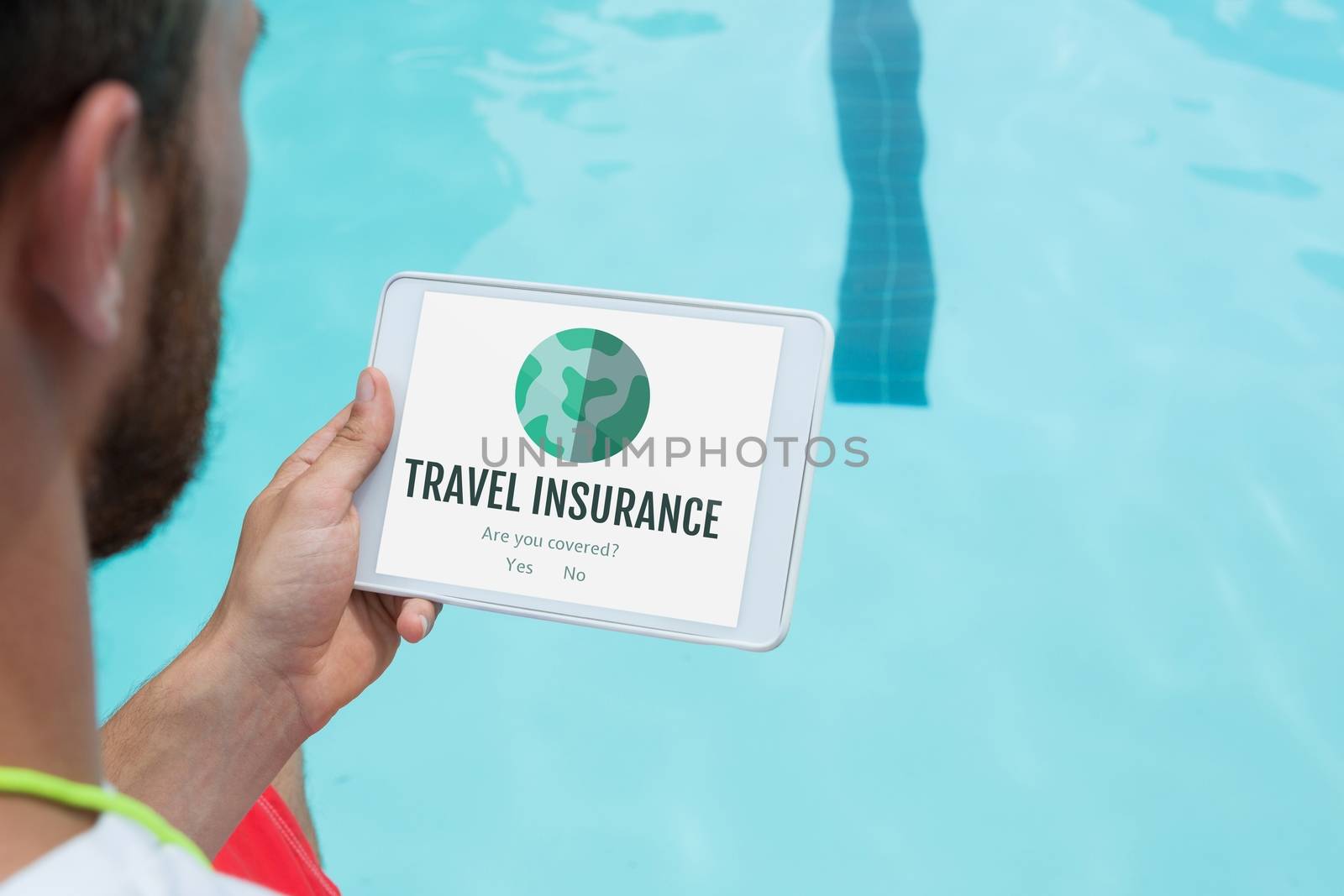 Man holding a tablet with travel insurance concept on screen by Wavebreakmedia