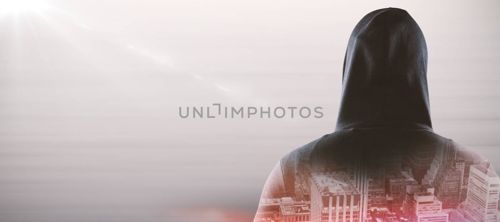 Rear view of spy in hoodie against composite image of abstract backgrounds