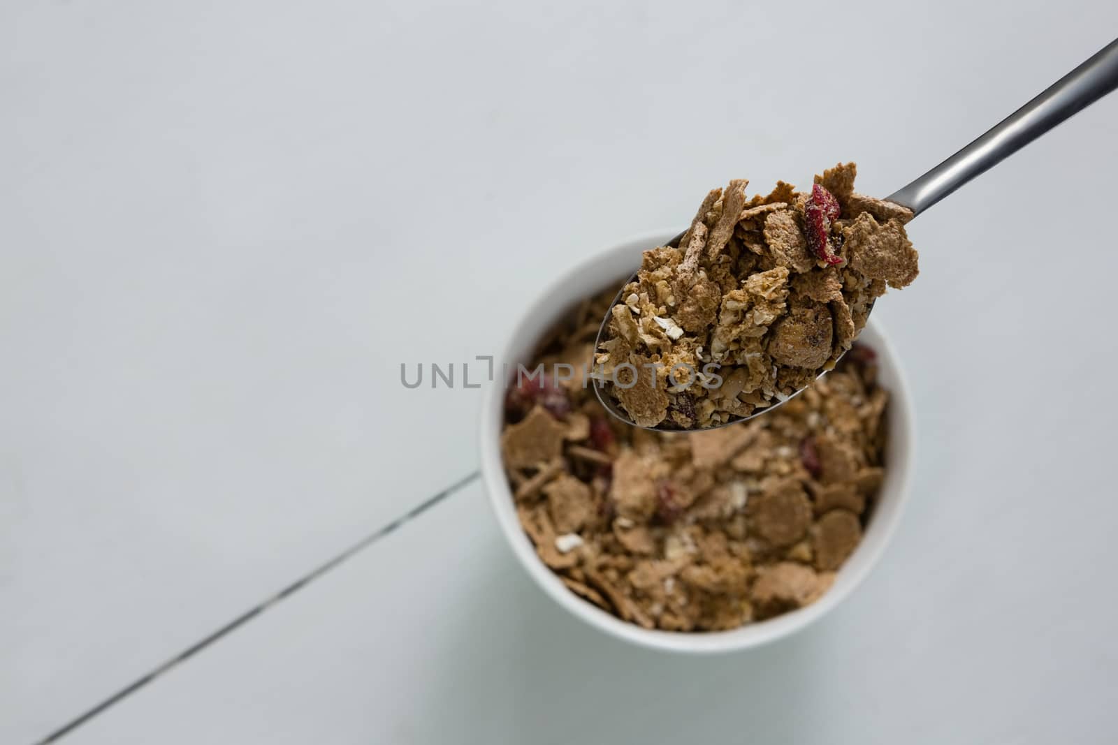 Breakfast cereal on spoon by Wavebreakmedia