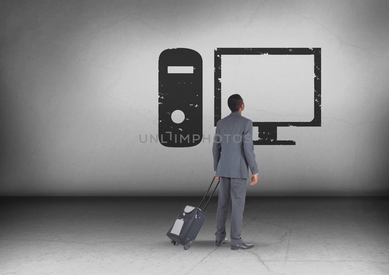 Businessman with travel bag looking up with computer icon by Wavebreakmedia