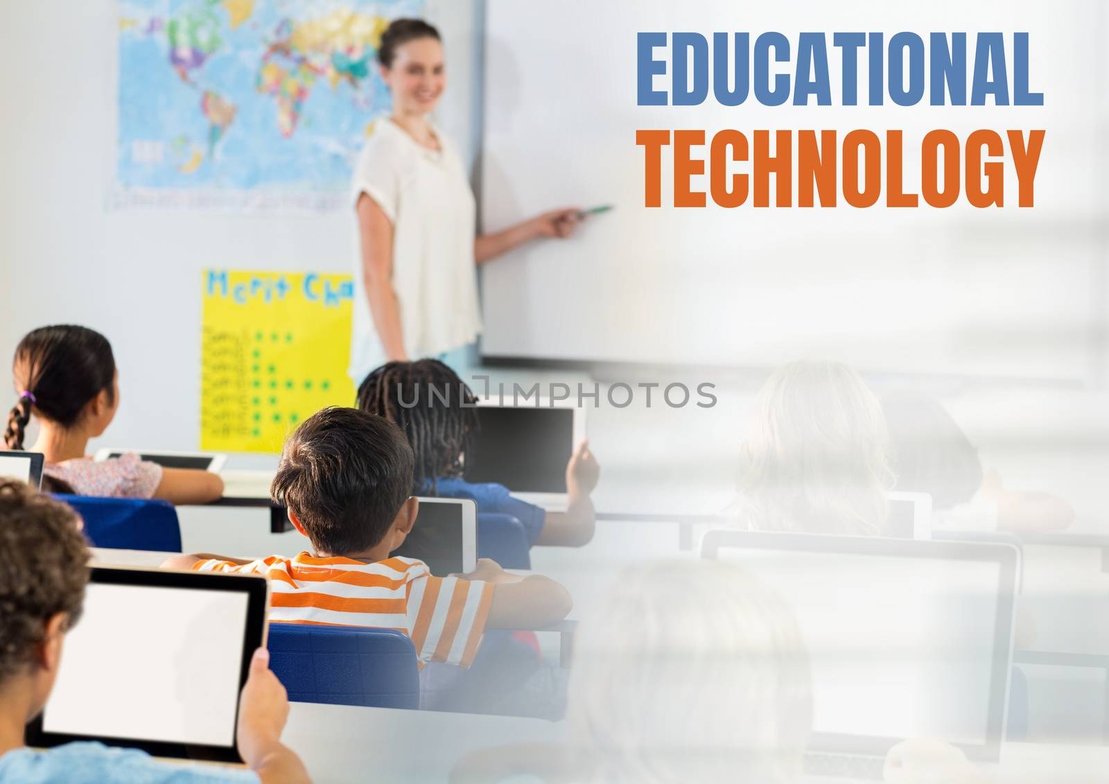 Educational technology text and Elementary school teacher with class by Wavebreakmedia