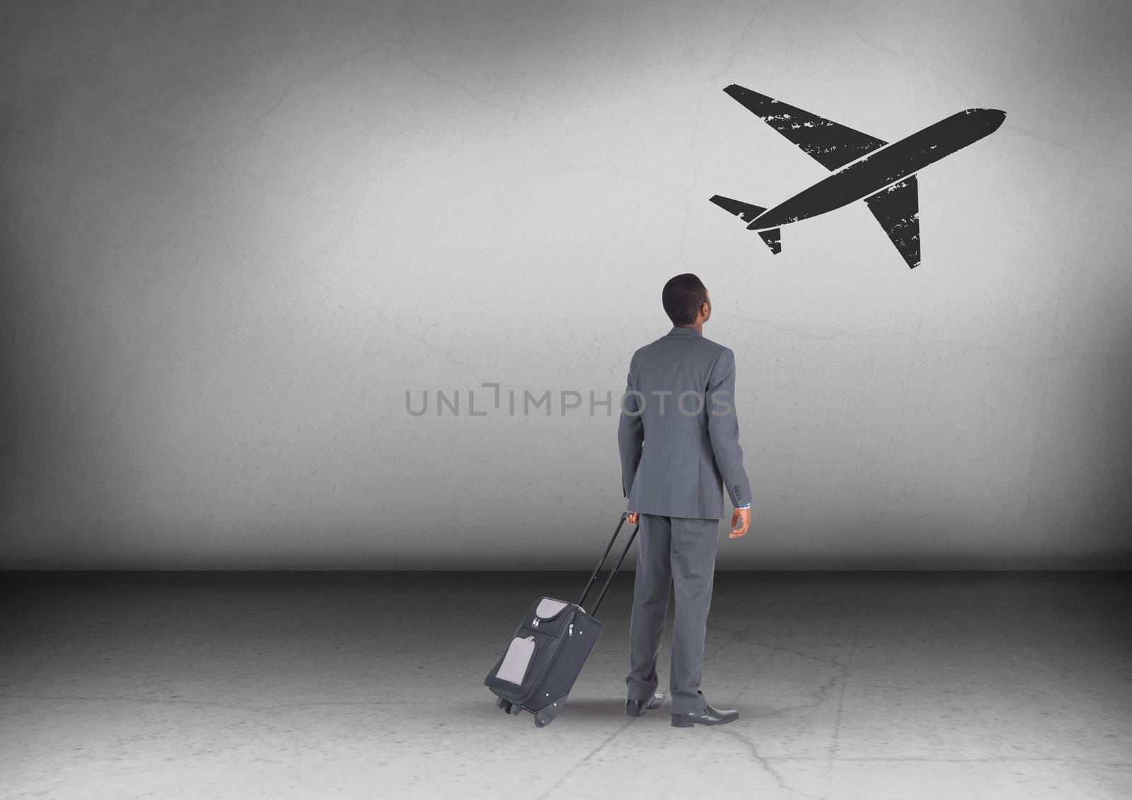 Businessman with travel bag looking up with plane icon by Wavebreakmedia