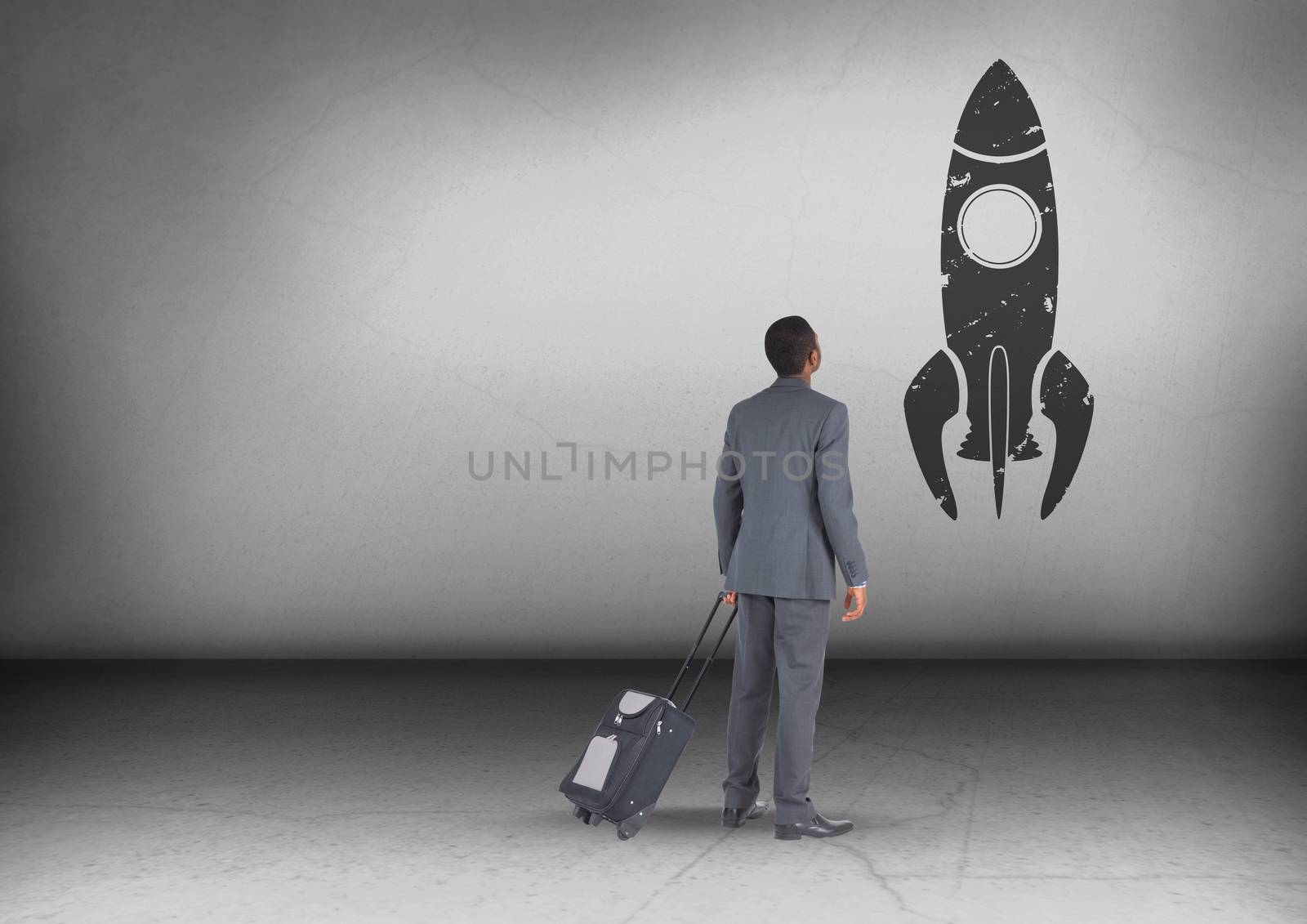 Businessman with travel bag looking up with rocket icon by Wavebreakmedia