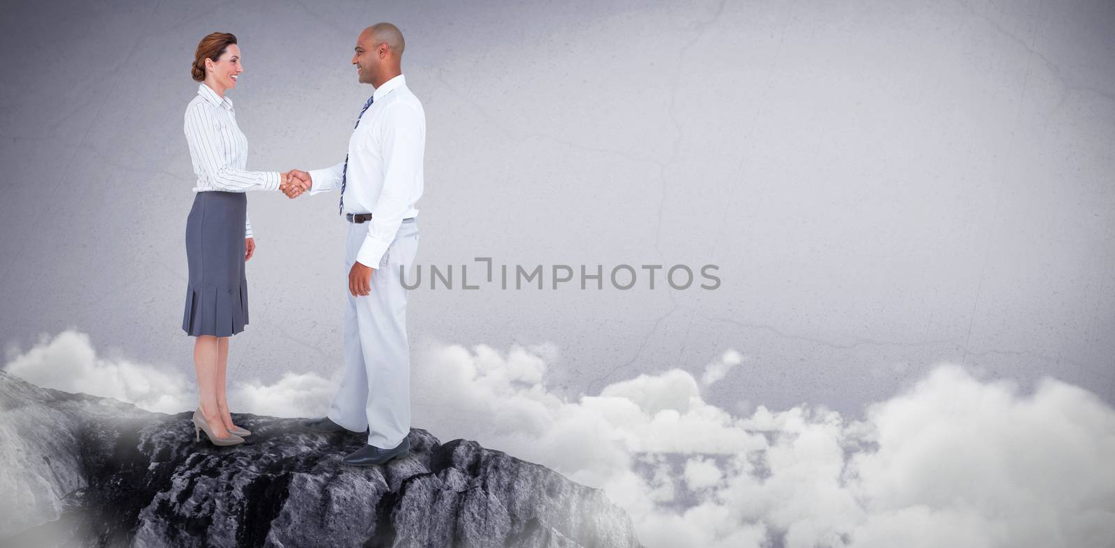 Composite image of business people shaking their hands  by Wavebreakmedia