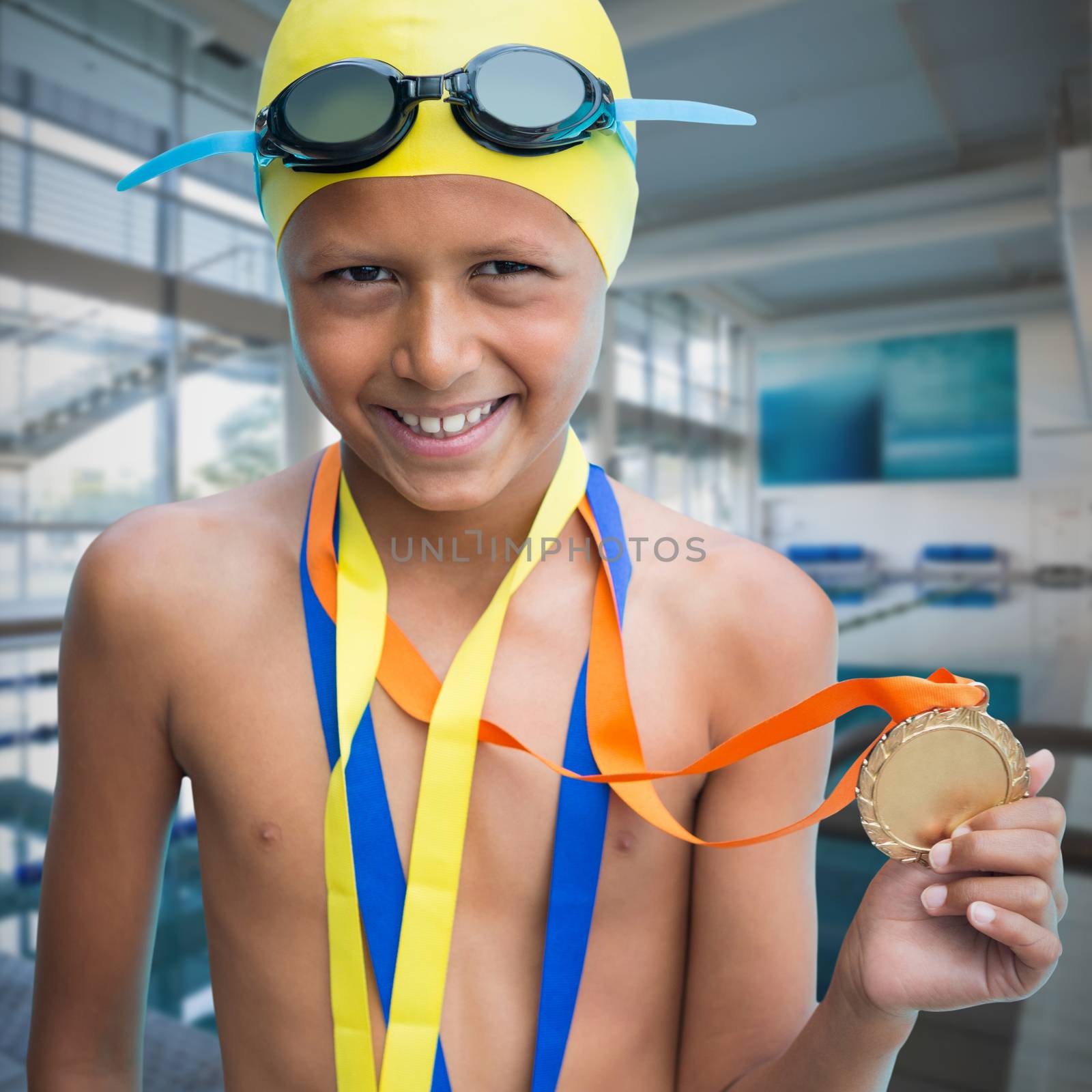 Composite image of portrait of smiling boy showing medal by Wavebreakmedia