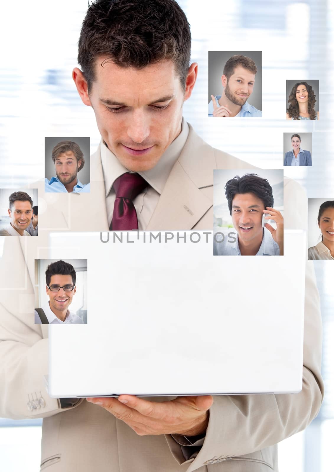 Man holding laptop with Profile portraits of people contacts by Wavebreakmedia