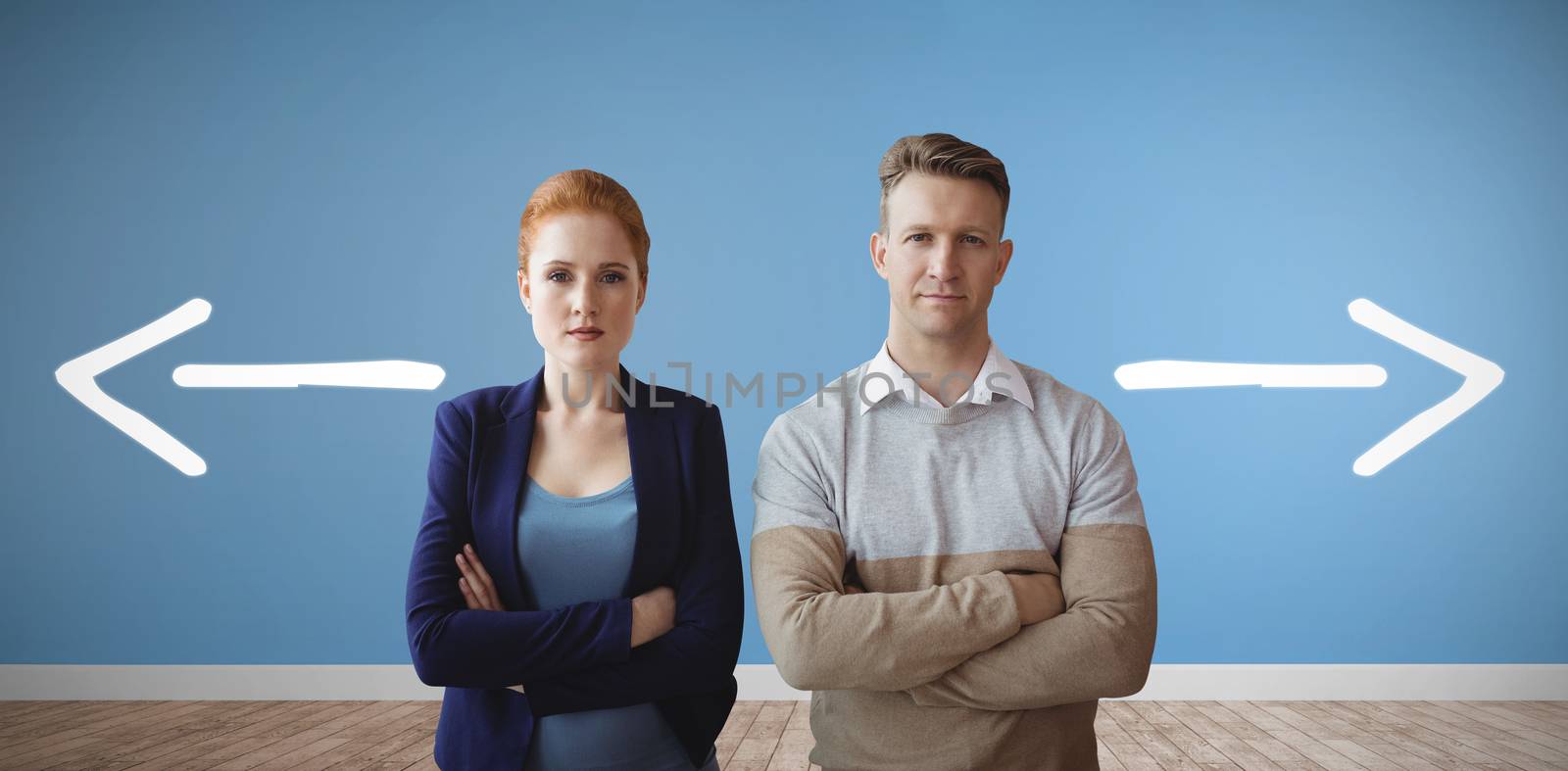 Business people looking at camera against room with wooden floor