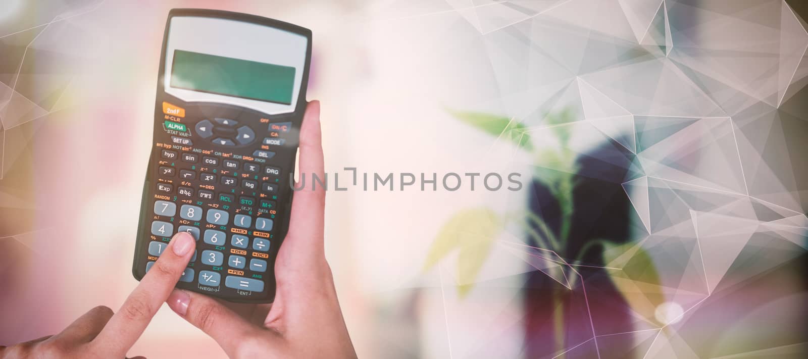 Hands of businesswoman using calculator against abstract glowing black background