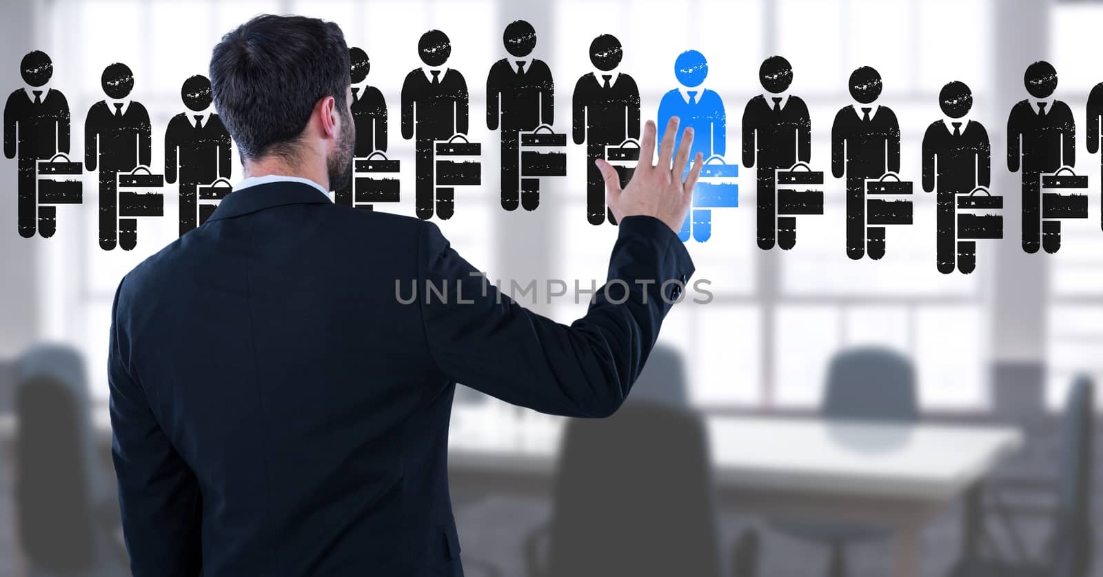 Digital composite of Businessman interacting and choosing a person from group of people icons