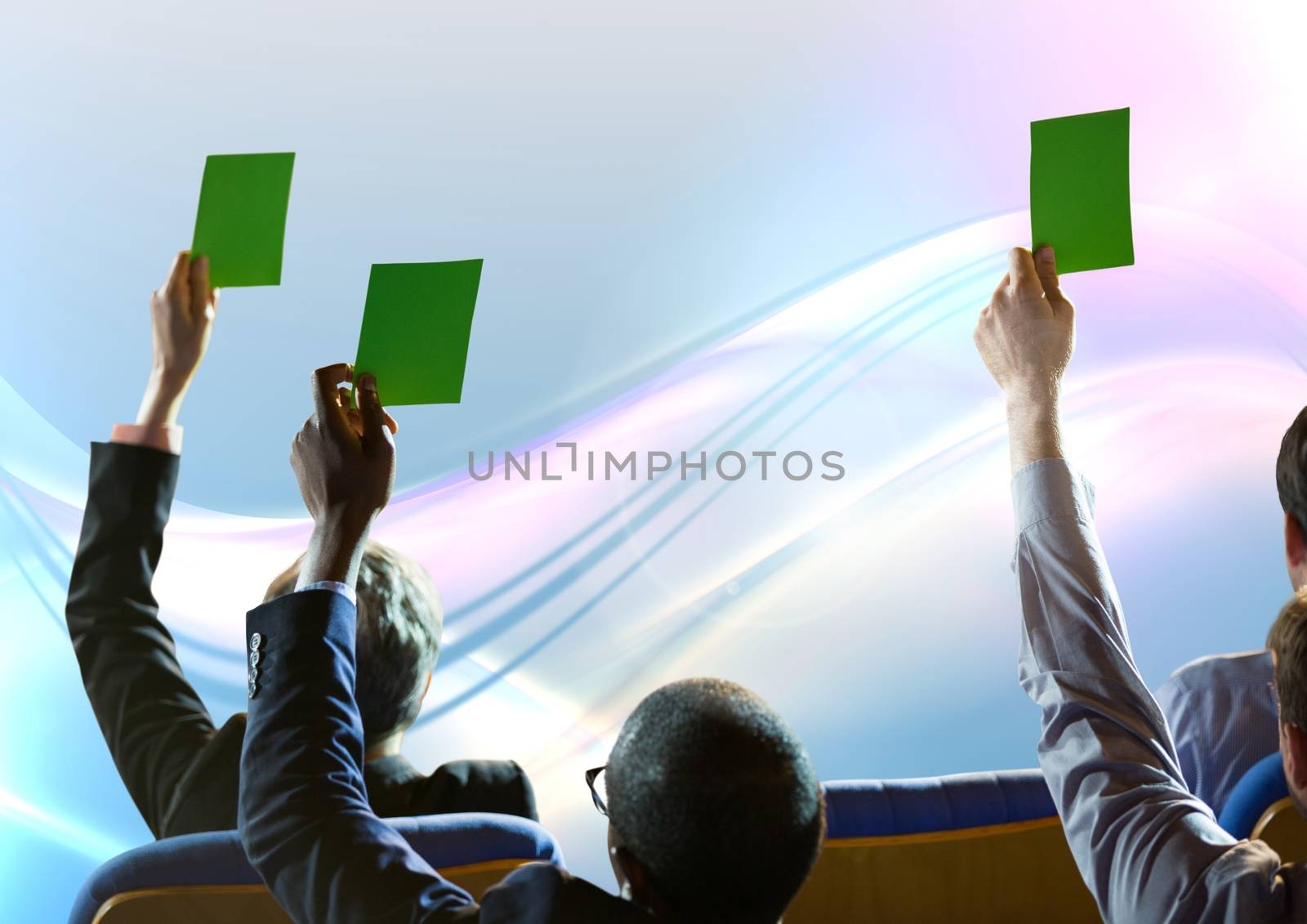 Digital composite of Business people holding green cards in seats